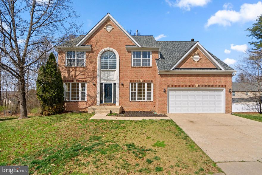 Stately and spacious, this expansive colonial is ideally situated on a premium cul-de-sac lot in the community of Longwood, and offers exceptional multigenerational living potential with a tastefully designed in-law suite on the lower level!   Step inside to find an open, two story foyer and loads of natural light throughout the home offered by an abundance of windows.  Hardwood floors are featured on most of the main level, including the convenient main level office/library with glass atrium doors, spacious living room and dining room with bay window.  The kitchen features granite countertops, stainless appliances and a center island offering extra space for meal prep, and seamlessly opens into the inviting family room with wood burning fireplace.  There’s also a convenient main level half bath and laundry room on this main level.  The upper level showcases an exceptional owner’s suite with two walk-in closets and a private sitting room, offering additional space that can be customized to fit your lifestyle. The en-suite bath is filled with natural light and features a corner soaking tub, separate shower and the dual sink vanity offers ample space.  Three additional large bedrooms complete the upper level, sharing a hall bath.  The impressive in-law suite in the lower level offers a perfect scenario of comfort and privacy.  The suite includes two bedrooms (both with egress windows), a generous living area with sliding glass door access to the backyard, an additional finished flexible space ideal for a gym or office, along with fully equipped kitchen.  The full bath features a large tiled shower with semi-frameless glass doors.  Upgrades include a newer roof, gutters, and HVAC.  Amenities include outdoor community pool, and community is strategically minutes away from Rt 1, I-95 and BWI Parkway, and in close proximity to Fairland Regional Park, Towne Center at Laurel, and the much anticipated Konterra Town Center.