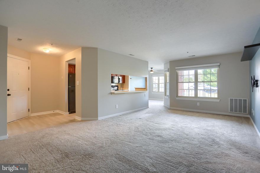 Welcome to 1712 E Landmark Drive, a well-maintained 2-bedroom, 2-bathroom condo in The Pond Condominium community. This inviting home features a functional galley kitchen that opens to a dining area and flows effortlessly into a bright, spacious living room. Large windows fill the space with natural light and provide access to a private balcony with views of the pond—an ideal setting for relaxing or entertaining.  The primary suite offers a large walk-in closet and a private ensuite bath.  A second bedroom, perfect for guests or a home office, is conveniently located near an additional full bathroom. Enjoy a prime location close to shopping, dining, and everyday conveniences, making this home a perfect blend of comfort and accessibility.