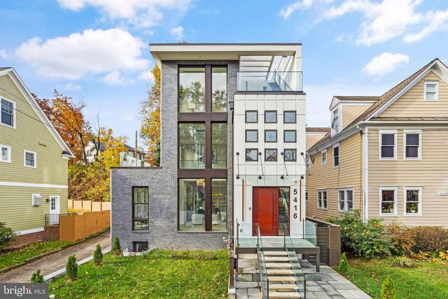 Daimler Builders proudly presents their newest offering in the prestigious Chevy Chase, DC. Meticulously renovated and masterfully expanded, this contemporary single-family home sits in one of DC's most coveted neighborhoods. Boasting a remarkable six bedrooms, six full baths, and a pair of half baths, the residence showcases premium finishes from the renowned Porcelanosa to custom German cabinetry by Leicht. It epitomizes luxury living at its finest. The well-conceived interior unfolds over four levels, all effortlessly connected by an elevator from the basement to the exquisite third-floor primary suite.

The Leicht kitchen cabinetry brings imaginative European design and streamlined functionality to the heart of the home. Equipped with Thermador appliances, including a professional-grade range hood, built-in freezer, fresh food column, gas range with griddle, and microwave, this kitchen will beg even the humblest chefs to expand their culinary acumen for their family and friends. Patio doors open to a deck, grass-yard space, and terraced gardens. It’s hard not to imagine a table with lights strung overhead, covered with empty plates and glasses, but full of laughter and new memories.

 

The living area effortlessly transitions into the rest of the home, accentuated by soaring double-height ceilings and expansive windows that bathe the space in natural light. Nestled just beyond the living room, discover a versatile nook, ideal for a cozy home library or an intimate dining setting.

 

Spanning an entire floor, the master suite is the epitome of luxury and tranquility. It greets residents with sophisticated conveniences like a built-in coffee maker and beverage refrigerator alongside a secluded den/study nestled amidst the tree canopies. Surrounding the bedroom, windows on three sides offer serene vistas of lush greenery, crafting an atmosphere of serene solitude. The plush bathroom is adorned with high-end Porcelanosa fixtures and cabinetry and features a lavish walk-in wet room equipped with a rain shower, wall shower, and a freestanding bathtub. Dual spacious walk-in closets ensure abundant storage. Additionally, exclusive rooftop access provides a private sanctuary for reflection and relaxation.

 

The second floor boasts two generous bedrooms paired with two splendidly appointed baths. Each bathroom radiates sophistication and is fitted with Porcelanosa cabinetry, faucets, solid-surface sinks, and refined fixtures.


Incorporating cutting-edge design, this home boasts integrated speakers across its spaces, ensuring a captivating auditory journey. The wine cellar is also thoughtfully designed with a refined storage solution, ideal for aficionados wishing to display and store their prized collection.

Each level seamlessly integrates expansive outdoor spaces, masterfully designed to flood the interior with natural light and lush greenery.

Elevating the allure of this estate is an elegant carriage house, complete with its own garage, multiple electric charging stations, and a luxurious one-bedroom ADU. This separate dwelling mirrors the luxury of the main residence, boasting a fully equipped kitchen and the convenience of an in-unit washer and dryer.

From boutique shops to gourmet restaurants, there is something for everyone within easy reach. Nature enthusiasts will appreciate the proximity to Linnean Park, a serene green space just a 15-minute walk away. This property's location offers a combination of peaceful suburban living with easy access to urban amenities and transportation options via the nearby Red Line Metro station at Tenleytown.