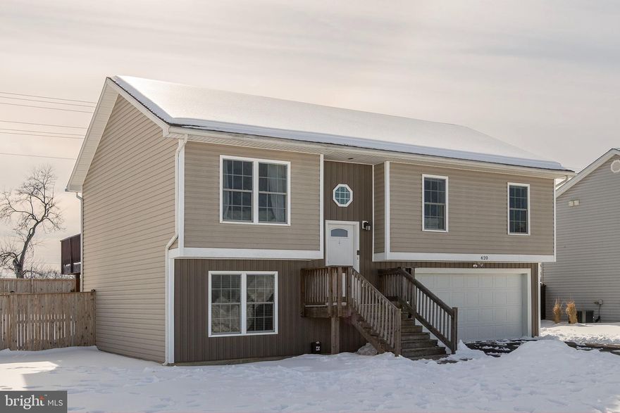 Looking  for a "like-new" home without the wait? Welcome to The Vineyards! This beautiful split-foyer features a granite-clad kitchen with a center island, high-end  stainless steel appliances, and gorgeous LVP flooring. Home features three bedrooms with  three full baths, living room and breakfast area..  Fully  finished walk-out basement—featuring a rec room with an adjoining bath and a built in Bar with a Wet Sink.   Perfect for entertaining or Man Cave.   Rec room could also be used as  a fourth bedroom..  Sliding  glass doors leads  to the patio area and a  fully fenced backyard. Meticulously maintained and centrally located in Martinsburg.  Great commuter location, close to shopping and restaurants.  . Schedule your tour today!