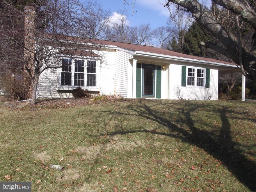Lovely tri level split home w/ open floor plan located on a private street.  large eat in kitchen, wood stove insert in living room w/ brick hearth, laminate flooring on main and third level. Large family room with sliders to spacious back yard. 2 sheds on property, lots of trees for shade and privacy, attached carport.  Carroll Co schools, Finksburg location, Home warranty included