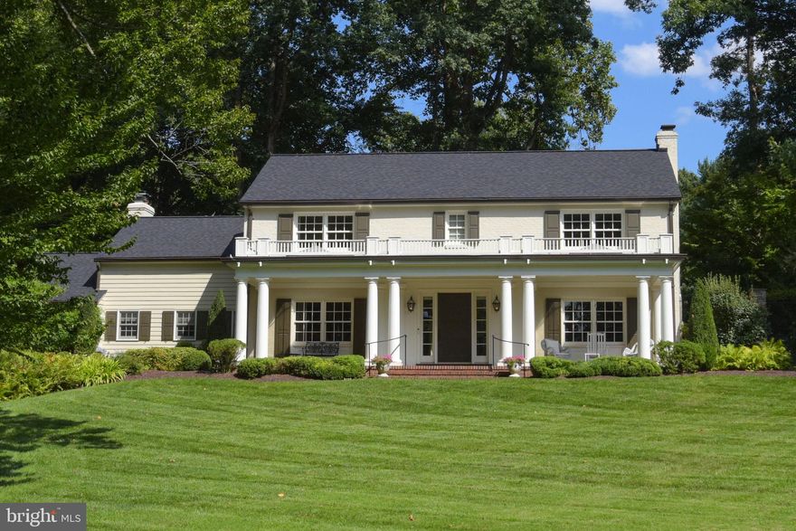 Immerse yourself in the captivating natural beauty and peace of Old Georgetown Estates in this enchanting one-acre oasis.   Surrounded by old world charm and character, you will sense the privacy of this property. The stately and quintessentially Virginian colonial style house sits high on a corner lot overlooking an expansive front yard.  Whether you find yourself rocking on the front porch watching the hummingbirds or walking the paths in back, you will be captivated by the beautiful landscaping and natural areas of the property.  An enchanting rose garden sits at the end of the property, offering a rainbow of colors and providing a serene and inviting area to sit and rest the mind and soul.  Or enjoy an active game of basketball on the court in back.  The property offers a rear patio with an 8-foot fountain, gas barbeque grill and ample room for a firepit – a perfect entertainment area. This 6 BR 5 BA home boasts an architecturally award-winning addition, with skylights, fireplace, built-in cabinets and shelves and triple windows.  Approximately 5489 interior Sq Ft, with Chef’s kitchen with island, recessed lighting, new quartzite tops and backsplash & hardwood floors, with charming views of the stone patio and fountain.  It is your choice to select one of two master bedrooms, (one upstairs or one downstairs) with ensuite bathrooms, marble floors, and marble showers and countertops. Located in the prestigious Churchill/Spring Hill/Cooper/Langley public school districts. Modern amenities include inground irrigation, exterior illumination, ADT security, back-up generator, stone patios, wrought iron fenced rear yard, pool, and outdoor grill – all surrounded by beautiful natural azaleas, flowering shrubs, and perennial flowers.  A striking home at any season.  The home has been meticulously maintained, with a new roof installed in 2023.  You will not be disappointed with this private paradise in close-in McLean, VA.