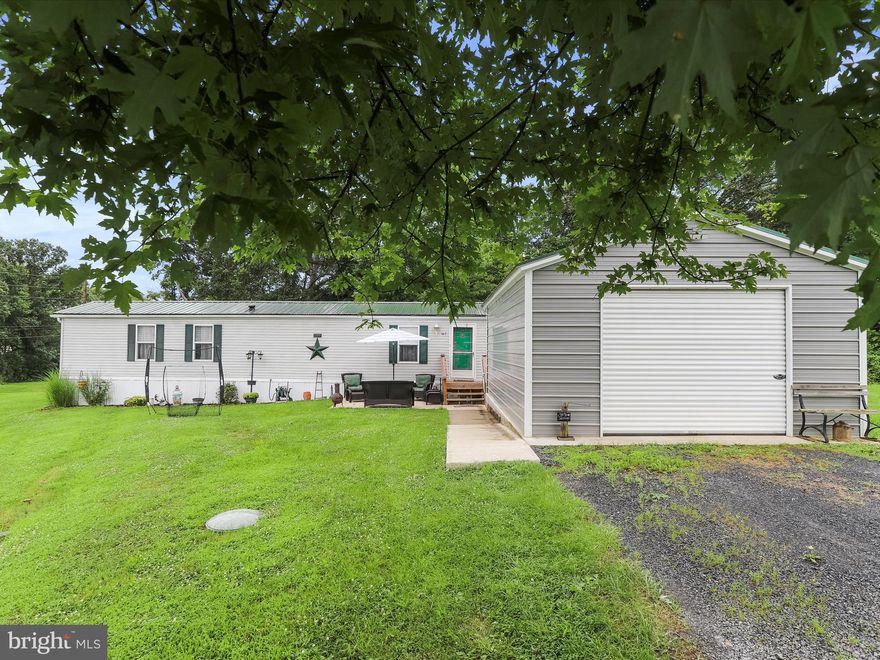 Move-in ready spacious home with oversized garage and large shed near the Potomac River! This kind of deal rarely shows up in a mobile home park. Grab it before it's gone! This is a 2 bedroom, 2 full bath home in great condition.  Windows were replaced in 2022 and metal roof was put on in 2018. The cul-de-sac location means no through traffic. Concrete patio and enclosed back porch are perfect for outdoor enjoyment. Plenty of parking for approximately 6 vehicles in front of the garage, so let the get-to-gethers begin. Need extra storage space for recreational equipment, vehicles, or holiday decor? You got it! The garage measures a whopping 18 X 25 feet with an overhead door (car lift does not convey), and the shed is generously sized at 10 X 14. Park residents have access to the community center as well as to the river and boat ramp. Lot rent for all this is affordable at $600 a month which includes $50 sewer fee. Buyer must apply with the park for the lot lease approval. If you are thinking about financing the purchase, please reach out . I will be happy to recommend a local lender who is very familiar with loans for mobile homes on rented lots. 5% minimum downpayment required.