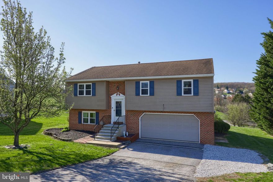 Move in ready home on over half an acre! Featuring  a bright and open layout with modern flooring throughout and a finished lower level. Solar panels offer the opportunity for lower electric bills! The main level includes a spacious kitchen that is open to the dining area and leads directly out to the rear deck - perfect for indoor and outdoor entertaining. Adjacent to the kitchen is a family room. A primary suite, two nice sized bedrooms, and a guest bath complete the main level. The lower level is completely finished for extra living space with a family room, fourth bedroom, and full bath/laundry area. The expansive deck overlooks your tree lined backyard. Nicely landscaped with mature shade trees. An expansive garage allows for multiple vehicles and a workshop area. Close to restaurants, shopping, and local amenities. Easy commute to I-83 and Rt. 30.