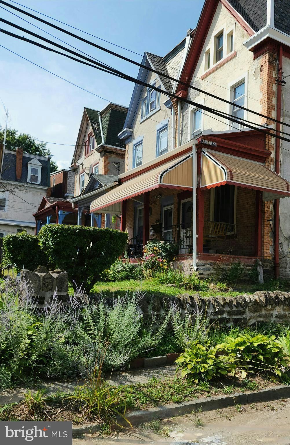 Victorian Twin , Corner Lot in Historical Section of Philadelphia. 2400+ sq ft, 6 Bedrooms, 2 Bath Home. 3 Stories/ 4 Levels of Straight thru living space. First Level/ Front Landing: 9-12' High ceilings, Pocket Doors. Broad Interior Staircase, Victorian Sash Windows with natural light/ spotlight the original charm. Formal Living Room, Formal Dining with a Hallway Parlor. Hardwood mill work and flooring. Breakfast Room and stand alone Kitchen with walk out to rear patio & garden. 2nd Level: Main Bedroom, built in double closets, vaulted heights, Interior and Post bedrooms with oversize windows; adjoined to hall entry Bathroom with dressing area. 3rd Level: 3 bedroom studio /loft with bath tub and shower. Lower Level/ Full Basement: Force Air Heating System ; separate storage, utility/Laundry hook up/ windows and potential egress. Front / Back Exterior Features: Fenced yard. Stone retaining perimeter wall, slate curb, cobblestone side street, seasoned Landscape. Close to Universities, parks, trails, and transportation routes for quick access to central Philadelphia / Suburbs and Quad-States . Great Opportunity - Charm, Size, Value and Location to start a home, invest, develop and refine your real estate portfolio. Home Warranty included.