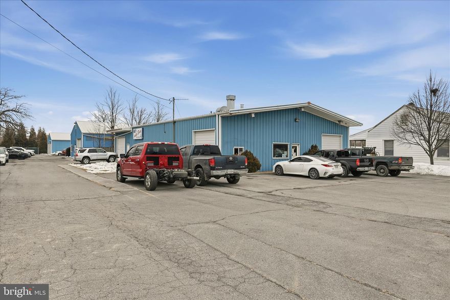 Turn Key Auto Service Center! Over 11K SF of garage, shop, service areas, warehousing, and customer/office/reception area. Faces Pleasant Valley Road with EXCELLENT VISIBILITY! 27x13 paint booth conveys. List of additional equipment available separately. Long standing, successful auto body/repair location ready for next generation! Multiple drive in doors and work bays. Could have multiple businesses. Zone CM1. Could also be contractors office, buildings supplies, machine shop, etc. Asking $1.5M.