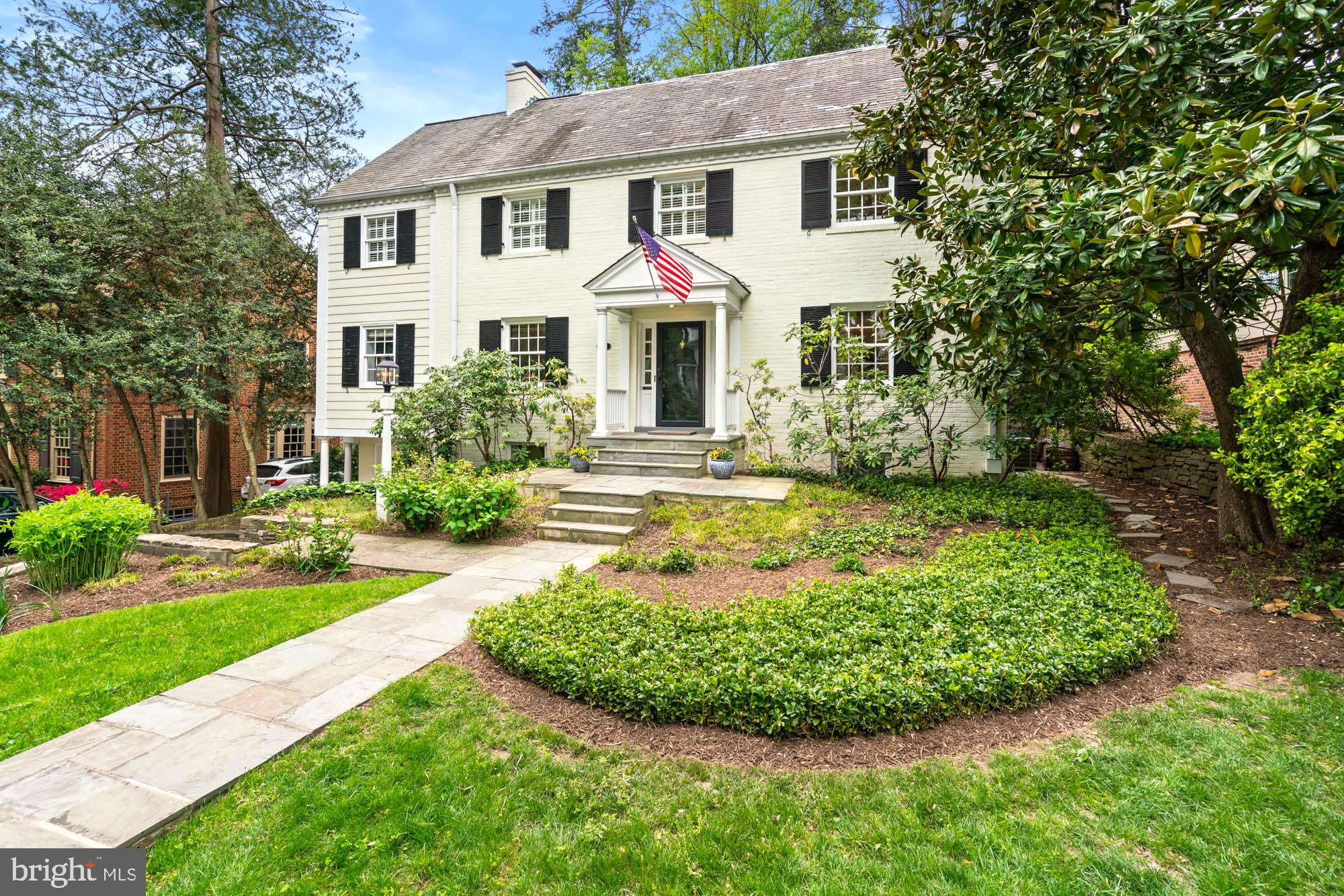 Lovers of classic crown molding, painted banisters, and the quiet dignity of a true center hall Colonial will immediately feel at home at 5304 Blackistone Road. Your first backyard dinner party under the twinkling café lights is only a few weeks away. A six-bedroom home, expanded and updated throughout with classic and traditional details, harmoniously designed to take advantage of every inch of functional space both inside and out. Like something from a movie scene, you can picture holidays and events, dinner parties intimate and grand, cozy rainy nights around the fireplace, and summer evenings dining al fresco on the terrace.
This six-bedroom, four-and-a-half-bathroom home stands out with its covered front stoop, spacious rooms, hardwood floors, recessed lighting, and elegant crown molding. Featuring 4,600 +/- square feet on four levels with a traditional floor plan and excellent flow.
A sun-filled, spacious living room is anchored by a fireplace with decorative mantle, gracious, oversized windows, and glass doors to the rear terrace and beyond to the fenced-in backyard. The family room offers built-ins and a window bench with storage, as well as floor-to-ceiling windows and glass doors to a captivating screened-in porch, while the formal dining room boasts crown moldings and original built-in china cabinets. The heart of the home is the spacious kitchen that offers room to lounge or dine, surrounded by a wall of windows, a center island with a breakfast bar and prep sink, and a suite of stainless steel appliances. Guests spill out to the back terrace for gatherings around the outdoor fireplace.
The second floor is highlighted by the primary suite, featuring a dressing room, custom dual walk-in closets, and an en suite bathroom. A private sitting room off the primary bedroom boasts 12-foot cathedral ceilings and skylights, flooding the space with natural light.
Two additional bedrooms and a full bath complete the second floor. A dedicated staircase leads to the spectacular third floor, which features two sizable bedrooms—each with walk-in closets and skylights—plus a Jack-and-Jill bathroom. There is also attic space for ample storage.
The lower level of the home includes a guest bedroom, another full bath, a recreation room with a fireplace, a laundry/storage room and a bonus gym or hobby space. This exceptional home also boasts an attached garage and a private driveway
Steps to the Capital Crescent Trail, Little Falls Park, and Westmoreland Park, 5304 Blackistone Road provides an ideal connection to the trails and parks of Bethesda. This spectacular residence offers tranquil living while being close to both Spring Valley and Westbard Square shopping districts, the Metro, downtown DC, and Bethesda. Westbrook, Westland, B-CC schools serve the neighborhood.
Timeless, inviting, and impeccably maintained, this home is truly one for the ages.