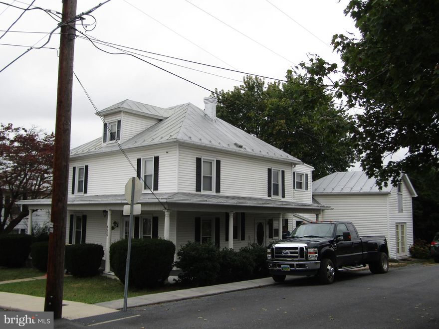 Historic home, fresh paint & blinds, this 4 bedroom home possibly a 5 bedroom with 1 full & 2 half baths. Charming wrap around front porch & nice rear deck with private back yard. Home has central air conditioning & heat pump for your upstairs. Air conditioning also on main level. Lots of charm in this home with formal living room & dining room.