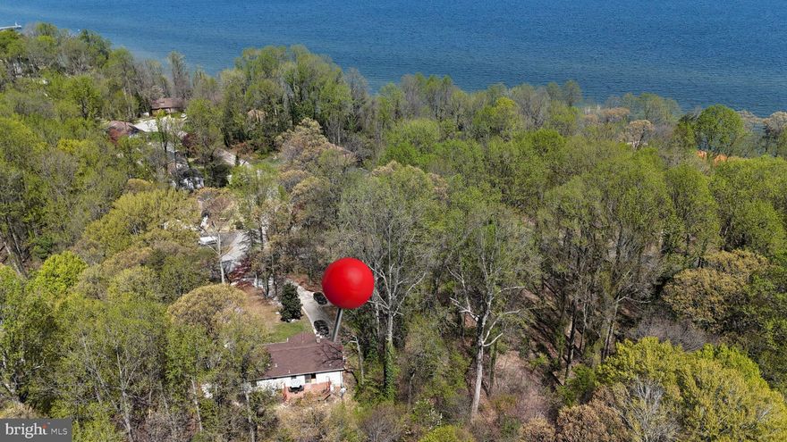 *** OFFER DEADLINE - WEDNESDAY 4/23 @ 5PM***

Welcome to 3570 Hilltop Drive—an adorable rambler nestled in the sought-after water-privileged community of Port Republic! Enjoy beach access just moments from your door and nearby marina conveniences, perfect for boaters and nature lovers alike.

This well-maintained home features a new roof, gleaming hardwood floors, and a cozy living room with a woodstove that adds warmth and charm. A step-down family room just off the kitchen offers flexible space and abundant built-in storage—ideal for hobbies, home office, or playroom. The bright and airy kitchen has granite countertops opens to a spacious deck via sliding glass doors, perfect for crab feasts and summer evenings.

The primary bedroom boasts gorgeous built-in Amish-crafted oak wardrobes, combining style with smart storage. There's also a separate laundry room, storage shed, and a paved driveway with extra parking. Don't miss the peekaboo views of the Bay—a lovely reminder of just how close you are to the water.

Come live the laid-back lifestyle with water access, community perks, and a cozy home ready for your personal touch.