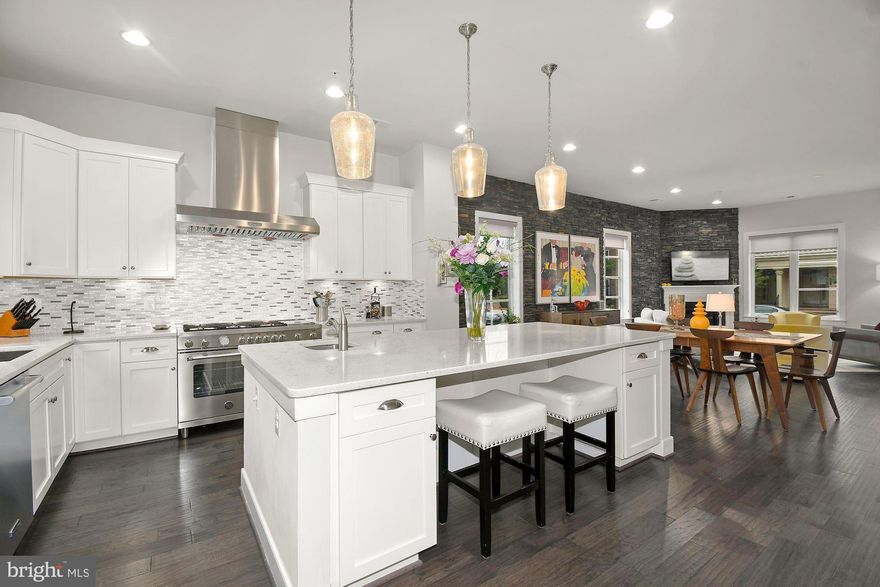 ****SOLD**** $50k ABOVE ASKING IN JUST 3 DAYS!! *****  Luxury, Lifestyle, Location all found in DC Metro’s most modern and commuter friendly neighborhood of Potomac Yard. This spectacular 5 bedroom, 4.5 bathroom, end unit, executive townhome w/detached 2 car garage/carriage house,  includes all of the high-end features and amenities you’ve been waiting for! You’ll fall in love with the oversized Ice White Quartz kitchen island that provides 40 sqft of counter space not to mention the spa like soaking tub in the primary en-suite, of which are only found in this 24’ wide floor plan!  Being on the end also certainly has its perks!  All the extra windows on the outer wall makes this one sun-filled gem like no other! Enjoy the 10’ ceilings on the first floor (9’ on all upper floors), chic stone clad accent wall in the dining/living room, SS appliance package w/new Bertazzoni 6 burner gas range & range hood, 3 ovens, under cabinet lighting, walls of 42’ white cabinets, and mudroom off the kitchen are just a few noteworthy items of just the main level!  Upstairs you’ll find the primary bedroom of your dreams: bring your king size bed, oversized dressers, enjoy a good book in the sitting area, or relax with a cup of coffee on one of the 2 balconies in this primary retreat!  California custom closet systems in both closets, luxurious en-suite comes w/ upgraded marble finishes, private commode, elegant and spacious frameless shower w/bench, window above soaking tub, dual vanities, and built-in linen cabinet! 3rd floor has 2 more spacious bedrooms, full bathroom, laundry rm, and one impressive family room great for watching your favorite sports games or creating an art studio/ home gym! Head to the 4th floor rec room to enjoy movie night with the built-in surround sound, full wet bar w/beverage cooler, another full bath and cozy up to the dbl sided gas FP inside or walk out onto the expansive roof deck terrace to enjoy phenomenal views of Potomac Yard and amazing firework displays on the 4th! 
One of the truly unique features of this highly sought-after layout is the detached carriage house. Not only does the carriage house provide you w/an abundance of additional storage space in the oversized, side loading 2-car garage but comes fully equipped with over 400 sq ft of living space in the studio apartment/in-law suite above! Separate HVAC/hot water heater, kitchenette set up w/beverage cooler, full bath, & tons of windows! Whether you seek turn-key luxury inside, or a multitude of entertainment areas outside, you’ve found yourself the one home that truly checks all the boxes! 
Potomac Yard is considered one of the best places to live because it affords the neighborhood feel, yet walkable to your favorite restaurants/shops/parks in Del Ray, & if all goes as planned by Spring this year you will also be able to walk to the Potomac Yard Metro Station (blue/yellow lines)! If driving is more your jam, less than 10 mins to Old Town Alexandria or Reagan National Airport. 2 miles north is Amazon HQ2 construction well underway with expectations to complete phase 1 of their two office buildings and 50,000 sq ft of retail space in 2023. If this weren’t enough to quench your thirst for your best investment purchase ever made, Virginia Tech’s Innovation Campus will eventually make its home on 3.5 acres of new mixed-use space adjacent to the future Potomac Yard Metro station in 2024!  The steady growth of home values in Potomac Yard will continue to thrive, despite the market conditions elsewhere, especially now that these community transformations are within arm’s reach! So, make the right decision to call 2108 Main Line Blvd “Home” today, and avoid feelings of immense remorse & regret of not doing so later down the road! You will be SO glad you did!