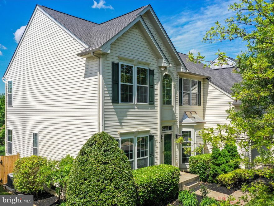 Welcome to this stunning Colonial-style home, offering 4 spacious bedrooms and 2 full bathrooms, plus 2 half baths, all within 4,275 sq. ft. of thoughtfully designed living space. The heart of the home features a modern kitchen with upgraded countertops, an island, and a pantry, seamlessly connecting to a cozy family room with a fireplace, perfect for gatherings. Enjoy the elegance of crown moldings and the warmth of hardwood floors throughout. The primary suite boasts a luxurious soaking tub and a walk-in shower, providing a private retreat. Additional highlights include a formal dining room, recessed lighting, and ample storage with walk-in closets. The partially finished basement offers endless possibilities. Outside, relax on the patio or enjoy the well-maintained common grounds and playgrounds nearby. With an attached garage and driveway parking, convenience is at your fingertips. This home is a perfect blend of comfort and style, ready for you to make it your own!