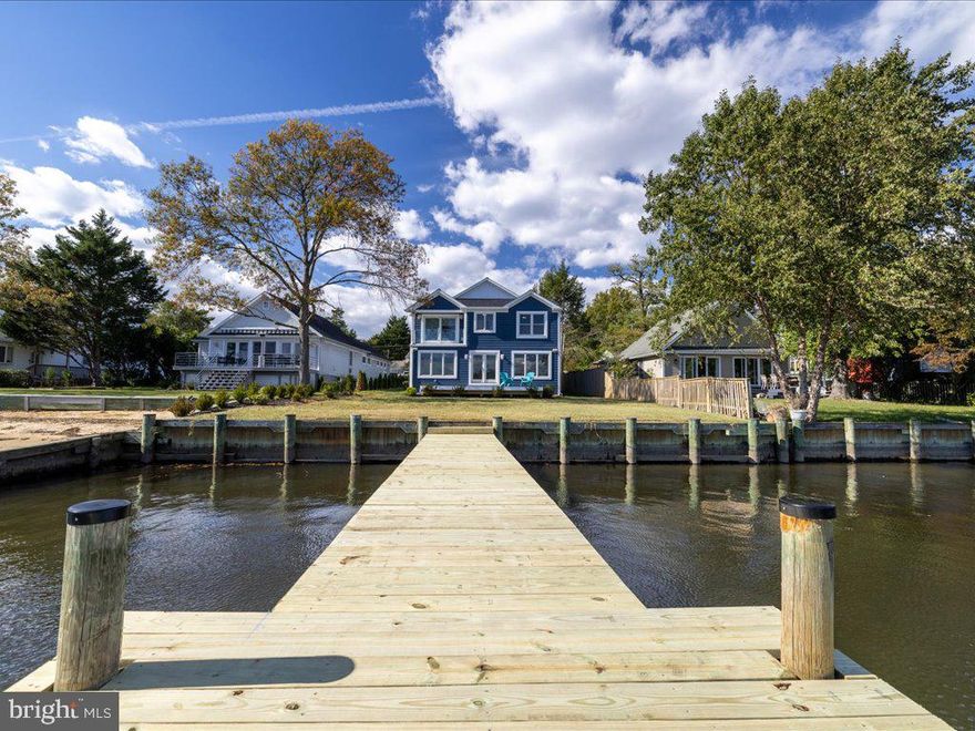 Waterfront Retreat on Little Magothy River, Annapolis.  
Welcome to this exquisite waterfront home situated on the scenic Little Magothy River in Annapolis complete with (Elevator) making this your forever home. This 5-bedroom, 4.5-bath property offers luxurious living with stunning water views and exceptional craftsmanship throughout its 2,800 square feet. Set on a .21-acre lot with a private pier boasting 3 feet of mean water depth, this home is perfect for boating enthusiasts and nature lovers alike.

Key features include two primary suites, each with its own beautifully designed bathroom, including the primary suite with a vaulted ceiling, a spacious walk-in closet, and a private balcony to enjoy sunrises. Inside, the home is adorned with custom trim and hardwood floors on the main level, complementing the open-concept design. The kitchen is a chef’s dream, featuring quartz countertops, shaker-style soft-close cabinets, a double wall oven with a warming drawer, a 42" chef's refrigerator, a wine fridge, an Advantium microwave/oven, propane cook-top, and a bar fridge in the pantry.

The home has a new well, public sewer, upgraded Andersen windows, and a new architectural shingle roof. The beautiful back deck offers a perfect space for outdoor entertaining while enjoying waterfront views.

Additional highlights include beautiful tile work in all four bathrooms, designer-inspired lighting and plumbing fixtures.  This home is equipped with a custom-built elevator (no need for a rancher or 55+ community), EV charging outlet, ceiling speakers on the first floor and outside speakers on the deck.  The 300 sf garage can be converted for additional living space.  
Permits in process to extend the pier and additional 50 ft which will give the mean water depth 5 ft.  Seller will be extending the pier 50 ft at the seller's cost and will also be installed 2 additional pilings so that the buyer can easily install a boat lift if desired.  If the pier is not built prior to closing the funds to complete the project will be put in escrow from the seller's proceeds.  

The community offers residents access to three beaches, 3 marinas and a community pool with membership, providing a serene lifestyle.  Blue-Ribbon Schools!  With all these upgrades and a waterfront location, this home is the perfect blend of luxury and comfort.  This home is NOT in an A or an AB flood zone.  Don’t miss your chance to own this exceptional waterfront property!