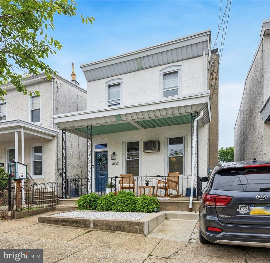 **OFFERS DUE SUNDAY AT NOON** Welcome home to this charming single-family residence in the heart of Roxborough/Manayunk! Park your car in your off-street parking space and step onto your large porch, accented with elegant wrought-iron posts — the perfect spot to enjoy your morning coffee. Inside, you'll be greeted by a spacious main level featuring gleaming hardwood floors that flow seamlessly through the dining and living rooms. Oversized windows flood the home with natural light, enhancing its warmth and character. Classic cast-iron radiators blend "Old World Charm" with modern updates like fresh paint and stylish light fixtures. Love to cook? The kitchen is a dream — granite countertops, solid oak cabinetry, and a functional butcher block island, offering plenty of workspace and storage. Just off the kitchen, the mudroom features a convenient main-level washer and dryer, plus a half-bath for guests. Step outside to your fully fenced, level backyard — perfect for summer entertaining on the patio with friends and family. Upstairs, enjoy the rare feature of dual staircases from both the living room and kitchen, leading to four generously sized bedrooms and a full bathroom.  This location is top notch; You're just a half-block from the iconic Manayunk Bike Race route and close to convenient public transportation options, including bus and train lines. Enjoy living in one of the most desirable neighborhoods with fabulous restaurants, bars, coffee shops, and parks within walking distance. Don’t miss this incredible opportunity to own a beautifully maintained single-family home with off-street parking!