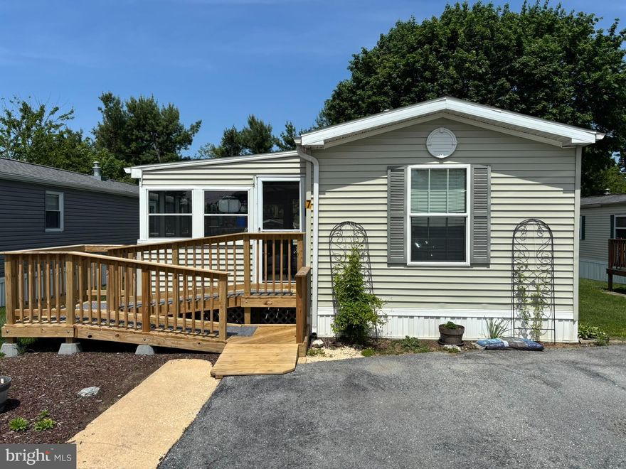 50+ Community in a great location. Walking distance to grocery stores, coffee shops, restaurants and more!
7 Penn Court has been well maintained. The split floor plan offers privacy for both bedrooms. A unique feature is the attached bonus room to the primary bedroom. Great space for an office, a craft room, home gym or any other space you need it to be. The enclosed front porch is a nice space to relax. The owner has created a lovely and manageable garden in the front while also carving out a patio in the back. You will find plenty of natural light in the home. Fantastic home for anyone seeking to downsize or have a low-maintenance home. Schedule your tour today!