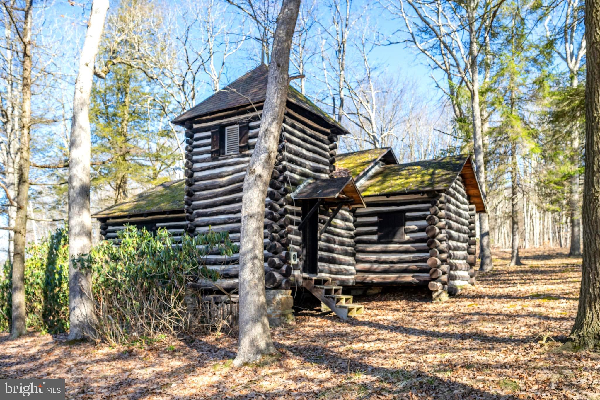 A real piece of Garrett County history! 800 sq ft chestnut log church, on 2.41 acres. built in 1933. A rustic interpretation of the once ubiquitous rural parish church, it was built to serve summer residents from Deep Creek Lake. The land & timber for the church were donated by seasonal residents, and constructed by local farmers & B&O Railroad workers. The structure is built of dark-stained saddle-notched chestnut logs with heavy, contrasting white chinking. There is no well, no septic. No electricity at this time. County has approved for at-grade mound sewage disposal system. Being Sold "AS IS". Call for an appointment to view this one-of-a-kind property!