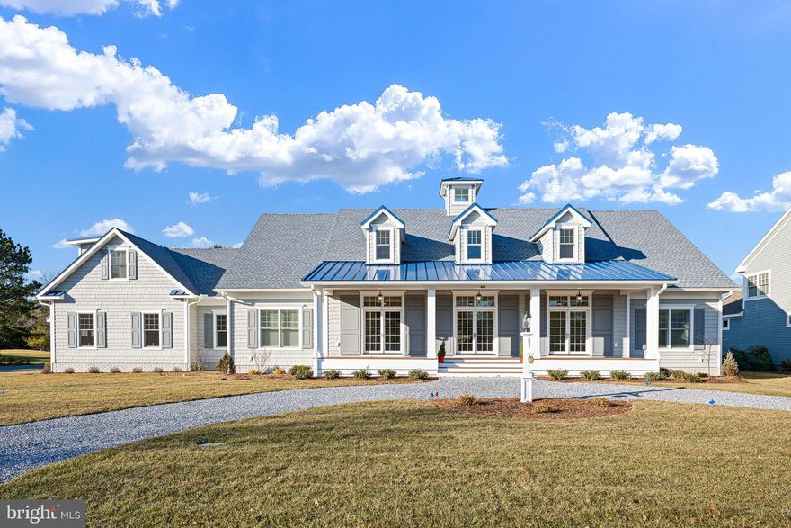 Welcome to 403 Canal Way East, an extraordinary brand-new custom build in the highly sought-after Bethany Beach community of Salt Pond. This luxurious 4,800 square foot residence is a masterpiece of thoughtful design and elegance, nestled on a generous one-third acre corner lot overlooking the 14th fairway of The Salt Pond Golf Course.

As you approach via the circular drive, the expansive front porch and stunning double door entry set the tone for the exquisite interior. Step into the grand two-story foyer, adorned with wood floors and custom inlay, and be immediately captivated by the elegant formal living room with a fireplace to your left and a formal dining area to your right. Both spaces feature French doors that open onto the front porch, creating an inviting flow for entertaining.

The heart of this home is the open concept living area, where the gourmet kitchen stands as a testament to luxury and functionality. It boasts stunning quartz countertops, a commercial-grade, six burner Wolf cooktop with griddle, double ovens, a Sub-Zero refrigerator, and a hidden microwave. The central island offers barstool seating and a prep sink, complemented by a generous pantry and ample storage. Adjacent is a beautifully appointed butler’s pantry with high-end cabinetry, a wine fridge, and a lighted display cabinet.

The adjoining family dining area features a built-in bay window seat with storage, seamlessly flowing into the bright living space with coffered ceilings, a fireplace, and custom cabinetry. French doors lead to a stunning all-season sunroom with vaulted ceiling, alongside an adjacent screened porch—ideal spots for relaxation.

The main level also includes two spacious ensuite bedrooms with luxurious bathrooms, featuring double sinks and thoughtful accessibility features. The primary suite offers a private deck with a trellis, a soaking tub, and a walk-in closet with custom cabinetry. High ceilings and exquisite wood floors throughout enhance the home's generous and unified atmosphere.

Completing the main level is an oversized two-car garage with commercial-grade doors, epoxy floors, and access to a mudroom that connects to the screened porch and an outdoor shower. Modern comforts are assured with the home's dual geothermal HVAC system.

The second floor offers a vast open space perfect for a variety of uses, along with a large bonus room ideal for a home office or additional living space. Two more ensuite bedrooms and two ample walk-in storage areas add to the home's versatility.

Every detail, from custom tile work to high-end moldings and art niches, underscores the unparalleled quality of this home.

Salt Pond is a vibrant community featuring an executive 18-hole golf course, recreational center, pools, tennis and pickleball courts, and more. Its prime location offers proximity to the beach and easy access to nearby dining and recreational opportunities, making it a perfect haven for Delaware beach lovers. Experience the unique blend of luxury and convenience that 403 Canal Way East offers—truly a must-see residence.