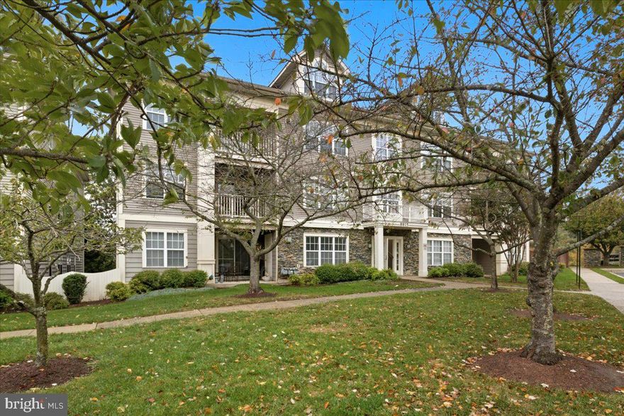 Beautiful and spacious 2nd floor condo in the highly sought after Stone Ridge community! This bright and airy unit features a gourmet kitchen with stainless steel appliances, granite countertops, a breakfast bar, and a separate dining area that opens to a large living room, perfect for relaxing or entertaining.  Step outside to your private balcony, ideal for enjoying morning coffee or fresh air. The primary suite offers a walk in closet and a luxurious bath with a soaking tub. A generous second bedroom and full hall bath provide comfort and convenience. Enjoy the ease of in-unit front-loading washer and dryer. Prime location just minutes from shopping, dining, and major commuter routes including I-70, I-695, and I-795. Don’t miss this move-in ready gem!