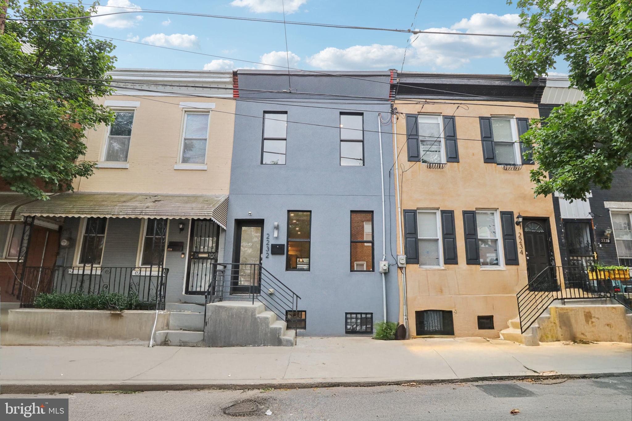 Welcome to this beautifully upgraded and move-in ready 3-bedroom rowhome in the heart of Point Breeze. Featuring neutral paint, updated flooring, and recessed lighting throughout, this home offers a bright and open living/dining area that flows seamlessly into a renovated kitchen with stainless steel appliances, including a new dishwasher. The kitchen provides access to a private, fenced patio—ideal for relaxing or entertaining. Upstairs, the spacious primary suite boasts a large closet, ceiling fan, and spa-like ensuite bath, with two additional bedrooms and an updated second bath completing the upper level. A finished basement adds flexible living space. Conveniently located near Passyunk & Rittenhouse square, and neighborhood favorites including Aldi, Target, Sprouts, Dock Street Brewery, On Point Bistro, and more.
