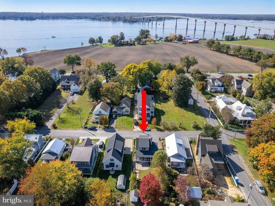 HISTORICALLY INSPIRED AVONDALE COTTAGE designed by John Toates, AIA. MOVE IN NOW! The Parker Cottage has been carefully renovated with lasting materials, both new and vintage. You will love the black sash windows, original floors and stair restoration, high craft built-ins, the architect-owner's vision and use of vintage styling and fixtures. Custom kitchen with gorgeous inset cabinetry, honed stone counters and a perfectly sized island is geared for the best cooks, max prep space. The upper level of the cottage has 2 bedrooms - each with a private bathroom including gorgeous tile choices. Relax on the front porch and enjoy sunset. There are garden boxes and structures in place for your winter crop and/or spring faves. On the private rear porch, imagine furniture placement for this sizeable living extension. This 'heirloom quality' home in the heart of Solomons is close to high quality marinas and restaurants, shops. Front loading washer and dryer upper level. Enjoy your beautiful Avondale Cottage for summer 2024!