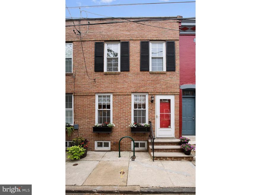 Don't miss this fantastic townhome on a gorgeous tree lined street, conveniently located in Graduate Hospital!  Enter through the newer brick fa ade with shutters and convenient storm door into the open concept living room with a ceiling fan.  Hardwood floors flow through the dining room and recessed lighting brightens the entire first floor.  The gorgeous custom chef's kitchen features granite countertops, abundant custom cabinetry including a convenient pantry, stainless steel appliances including a drop in range, a wine refrigerator, and a slate subway tile backsplash.  A small patio is located off the kitchen for bbq'ing or potted plants.  Upstairs, there are two spacious bedrooms, each with a large closet and a ceiling fan.  The full 3 piece bathroom has bead-board accents, a white tile shower, Jacuzzi bathtub and slate flooring.  Off the back bedroom is a small deck which leads up to the maintenance-free Trex roof-deck with Center City skyline views!  The basement is finished with tile flooring for an extra den/office or playroom and offers abundant storage.  Washer, dryer and all mechanicals are also located in the basement.