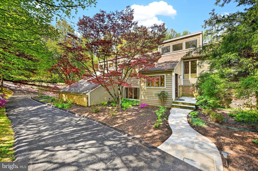 Welcome to 16 Seven Springs Court, a stunning contemporary home in Greenlands Hunt Valley. This meticulously updated 5-bedroom, 4.5-bathroom residence blends style, function, and beauty, offering abundant natural light and scenic views throughout.

The main level features inviting social spaces, including a dining room, a living room with a pellet stove, and a dramatic family room with a wood fireplace, wet bar, and loft. The primary suite and laundry are also conveniently located on the main floor, with four additional bedrooms and two full bathrooms upstairs. The newly renovated lower level includes a full bathroom, bar, entertainment center, gym, and workshop.

Situated on a private 2.77-acre lot with verdant flowering landscaping, the property boasts an expansive deck overlooking a large lawn and woodlands. Its prime location between Jacksonville and Hunt Valley provides easy access to shopping, dining, and outdoor recreation, including the Northern Central Railroad Trail (NCR).

The current owners have performed extensive updates, including:
- Roof and skylights (2022)
- Basement renovation (2022)
- Whole-house RO system (2024)
- Well pump (2023)
- Sliding doors and exterior drain system (2019)
- Kitchen (2015)
- many others

Come fall in LOVE!