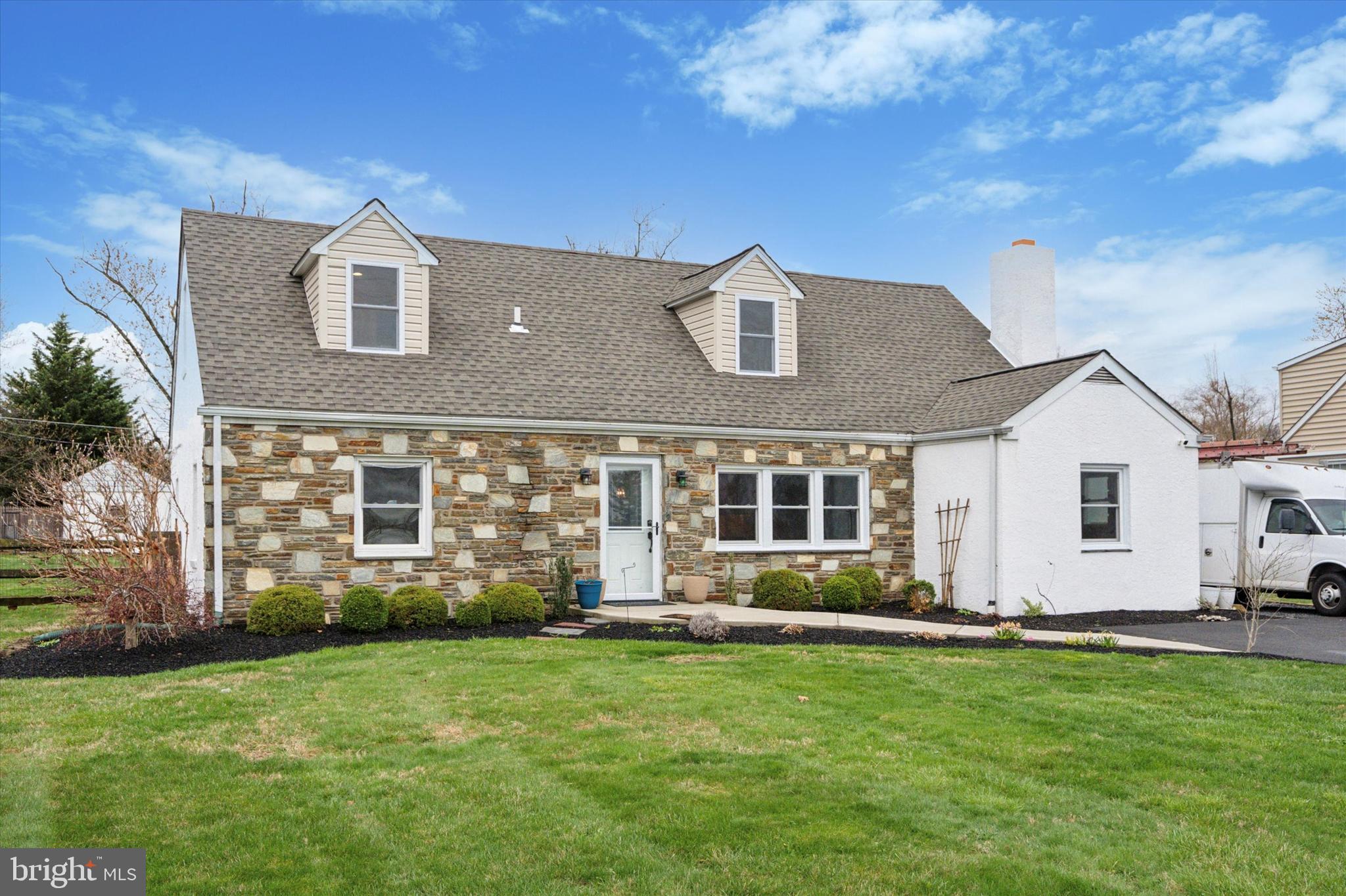 Welcome to this spacious and updated single-family home located in desirable Maple Glen and within the top-rated Upper Dublin School District. With 4 bedrooms and 3 full bathrooms, there’s plenty of room for family, guests, or a flexible lifestyle. Two bedrooms and a full bath are conveniently located on the main level, perfect for multi-generational living or home office needs. The kitchen features granite countertops, stainless steel appliances, and a stylish tile backsplash, flowing seamlessly into the dining area. A barn door under the staircase hides a clever storage space, while a wood-burning fireplace adds warmth and charm to the cozy living room. Just off the kitchen, you’ll love the sunroom—an inviting spot to enjoy your morning coffee or unwind with a book. Step outside from here to a covered patio, ideal for grilling or relaxing in the shade. Upstairs, you'll find a stunning, newly remodeled primary suite complete with a large bedroom, two walk-in closets, a laundry room, and a luxurious en-suite bath with a dual vanity and a glass-enclosed shower. An additional spacious bedroom on this level also includes its own full bathroom, offering privacy and comfort for family or guests. The expansive backyard is perfect for entertaining and everyday enjoyment, featuring a large patio area, fire pit, and ample green space for pets or play. A storage shed keeps tools and equipment neatly tucked away, and a 4-car driveway provides plenty of parking. Other highlights include a new roof, all new windows, a newer well pump, and easy access to Route 309, I-476, I-276, shopping, restaurants, and local amenities. The home is less than a 5 minute drive to Mondauk Commons park, downtown Ambler and SEPTA train station. Don’t miss your chance to enjoy summer cookouts and gatherings in this move-in ready home. Schedule your showing today!