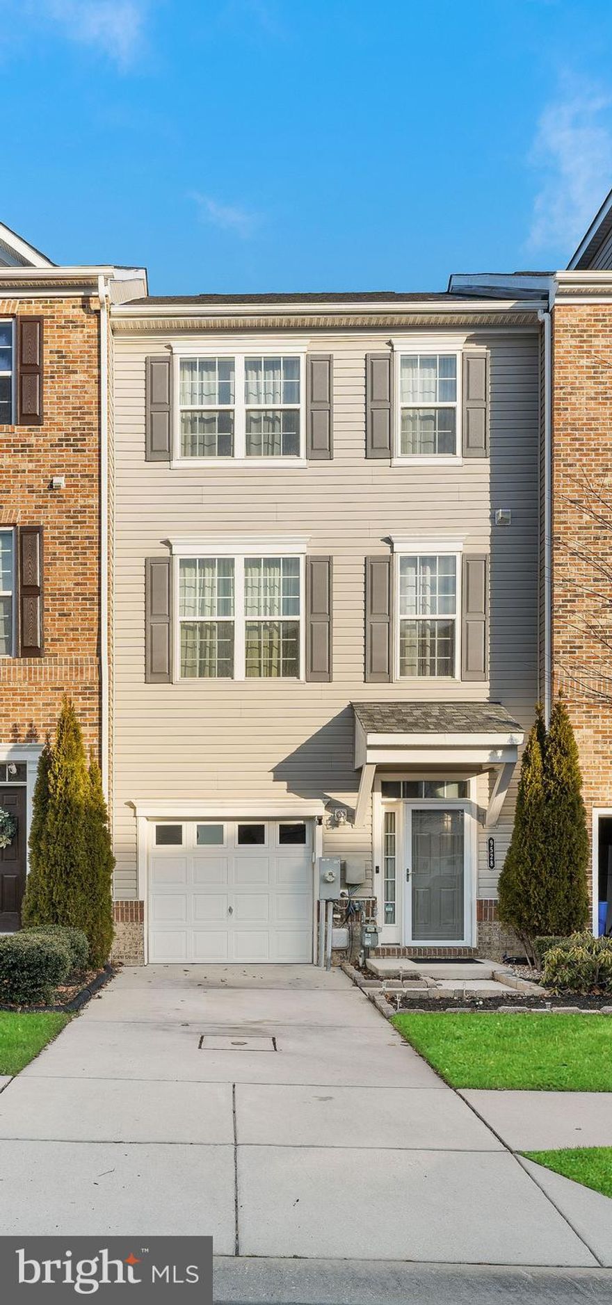 Don't miss this beautiful well maintained three level townhome is located in the highly sought after Ballard Green community.  The first level features a recreation room that could be used as an office or workout room. This home is spacious, boasting 9Ft+ Ceilings, gleaming hardwood floors, recessed lights, stainless steel appliances, low maintenance composite deck perfect for relaxing and a fenced in backyard. The living room draws in lots of natural light. The primary suite consist of a large walk in closet, an en-suite with a walk in shower and soaking tub. A one car garage with parking pad and additional guests parking spaces. This walkable community has all the features you could want and more: Clubhouse, fitness center, outdoor pool, community park, play, and rec areas. Schedule your appointment today!