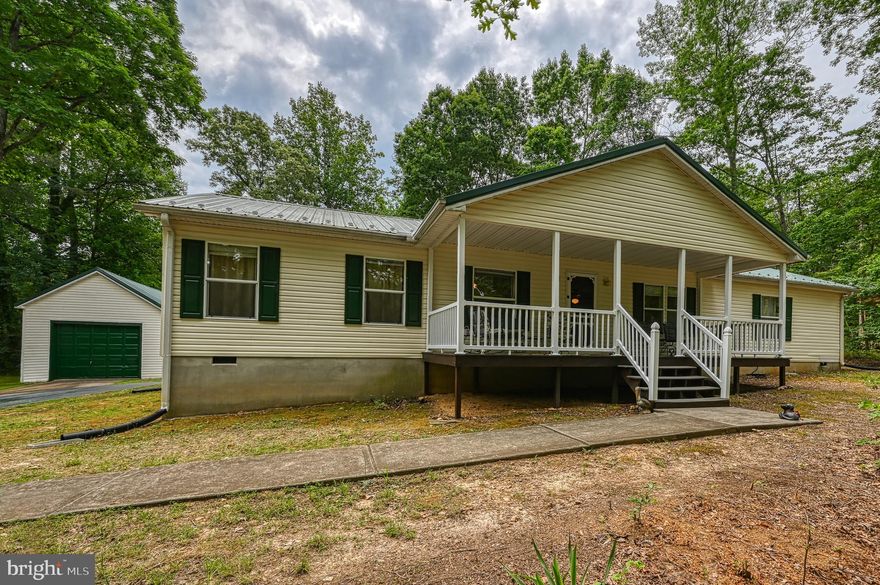 Realtor Owner. Large Modular Ranch Home withDryWall through out. Garage is a Stick -Built Cedar under the Vinyl Siding with work shop. If, You want Country and Lake Living This is the Home for YOU!!Be one with Nature at the Home and Enjoy Peace and Quiet. A Great Deep-Water Dock Assigned Slip 84. The House is being Sold with All Furniture and TV's. Ready to Move IN.Renovated in 2022 with interior Paint, Carpet and Luxury Vinyl Planks. Also, Bathrooms have Tall Toilets,Kitchen Appliances, Made in the USA, Whirlpool. Washer and Dryer Maytag's. Deck 2x6's cured for 1 Year and Stained2024. Workshop in the garage. Large Guest Bedrooms with Large Master, Split and Open Floor Plan. The House was Built with Low Maintenace in Mind. Heat Pump 2022, For AC and Heat with Back-up Propane. 60 in. Sony TV in the Great Room with 2 new Italian Leather Electric Tilt Couches and Phone Chargers.Look At The Pics!!! All Funiture is Going with the House Except for Personal Wall Hangings.