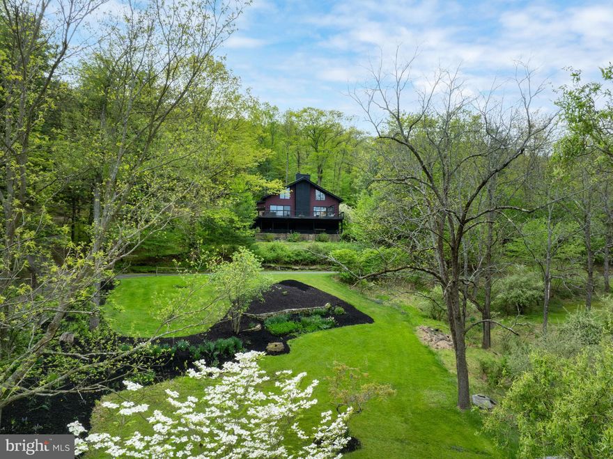 Looking for a secluded chalet that offers privacy, stunning nature views and lots of room to relax and explore? This property offers all of this and more on 46+ wooded acres! Step into the charming chalet which features a 2-story great room with a stunning wood-burning stone fireplace that features a live edge mantel from a tree on the property. A large eat-in kitchen offers painted cabinetry with pull out pantry and pot drawers and the sliding glass doors lead to the massive deck overlooking the property. There are two bedrooms on the main level along with convenient first floor laundry. Between the two bedrooms you’ll find a stunning updated bathroom with an oversized walk-in travertine shower with dual heads and open space. The double vanity boasts quartz tops and granite can also be found around the shower. The third bedroom is oversized with a vaulted ceiling, half bath and connects to two smaller lofts that overlook the great room and the spectacular views outside. You’ll find views from every window! The garden enthusiast will love all the different types of trees, flowers, plants and shrubbery found throughout the property while the nature enthusiast will love the seclusion, ponds and countless areas to take it all in. Don’t forget about the hunting & fishing enthusiasts that can do it all just steps from the front door on the 46 acres of wooded acres and 3 lovely ponds. Other features include a detached garage and additional storage shed used for wood. All of this in under 10 minutes from North Atherton Street! Don’t miss your opportunity to own something special. * Seller is licensed PA Real Estate Agent.