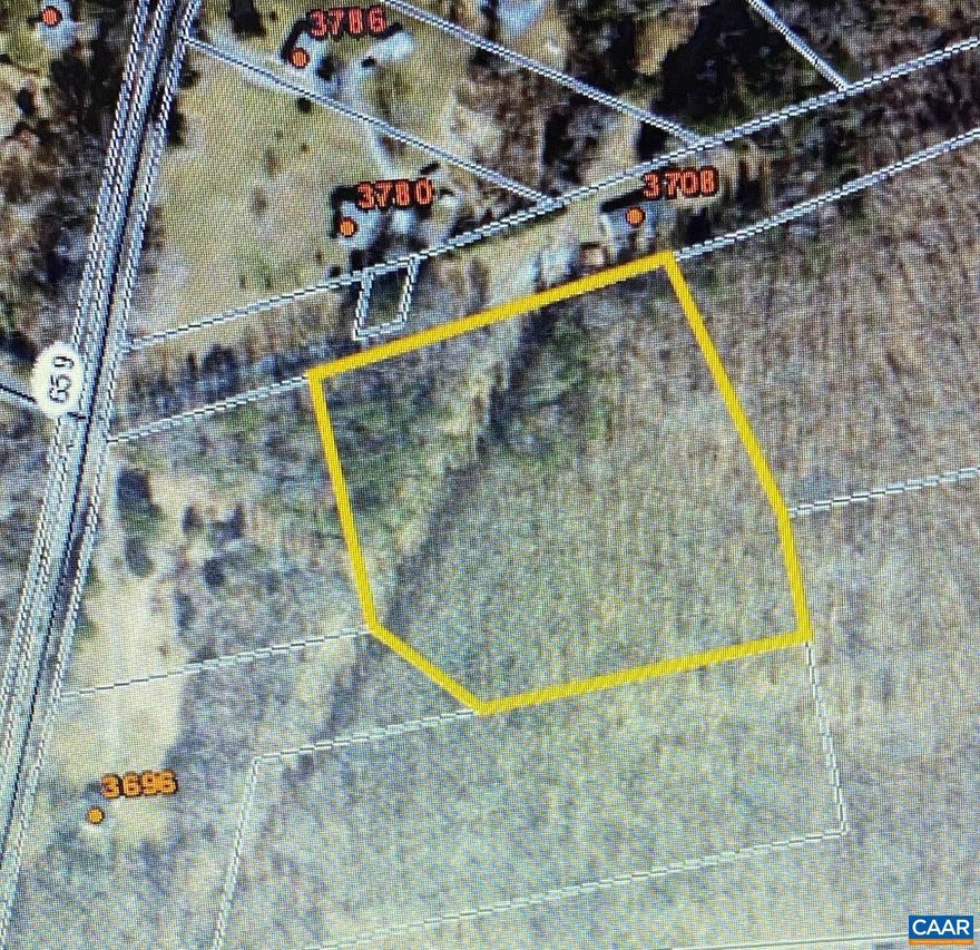 A really nice wooded lot to build your home. convenient to 64 and privately tucked back behind another parcel. Easement to this lot. You can park at the end of the driveway to 3696 Kents Store Way but please do not block the driveway.  The power line can be followed back to the 4,55 AC parcel