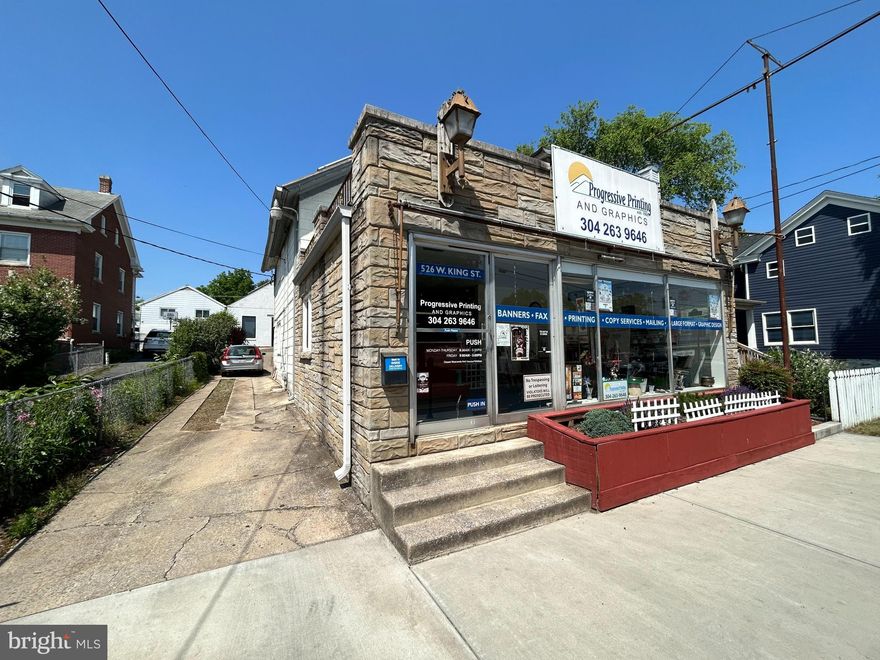 Take a minute to consider this amazing property for sale.  Located on traffic heavy West King Street, the exposure here has a very high traffic count. Only steps away from the Old Kilbourne Mill and it's $100,000,000 renovation into 411 condo's and 5000sq ft of commercial space, this property is poised for success.  Enter past the huge front windows and into the 312sqft showroom where you'll find the customer counter and conference table.  The offices are just behind the counter and lead into the Print Shop where you'll find the bathroom and more storage area.  Windows and HVAC have been replaced in the last 5 years.  The entire front footprint space is 2056sqft.  This building has a solar array and power diverter to offset the majority of the electric bills.  Huge benefit!

Exit to the back and into the Press Room.  The Press Room is 1860sqft with 12ft ceilings and a 6in concrete pad.  It has new commercial glass installed by Berkeley glass.  This space also has its own solar array with power diverter to offset the electric bill.  The back of the building has 12x10 commercial garage door for large truck access.  There is a large concrete pad to pull in from the rear alley. The dumpster conveys with the sale.  There is a huge storage room over the Press Room with ladder access.

In addition, there is a 2 garage with sliding door that is 22x18 with a large sliding door.  Perfect for extra storage.  

Exit the Press Room and enter the space above the Offices and Print Shop where you'll find 2, one bedroom apartments.  The co-Owner currently lives in and one and its in perfect shape.  The other one needs a small bathroom renovation to make it market ready.  

This commercial mixed use property has 4 rentable spaces.  The office/print shop has a rentable market value of about $2000.  Each of the apartments could rent for about $1000 and the Press Room also has about a $2000 rent value.  That's about $6000 if bought strictly for rental use. This equates to more than 10% cap rate.  

The seller paid $98,000 for both solar arrays.  The value for this type of improvement is measurable an very valuable.  The location is also incredible as the area around it will explode in the next 1 to 3 years.