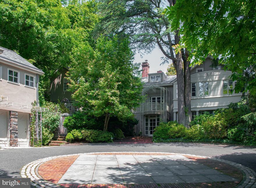 Set into an idyllic landscape of specimen plantings, flat stone terraces and tiered recirculating trough fountains on 1.69 gated acres, this home is like no other in terms of style, quality of construction and exciting architectural detail. A 5-6 bedroom main house redesigned in 2012 by celebrated architect Carlas Valhonrat, co-worker of Louis I Kahn, with recent comprehensive updates to the kitchen and baths by the current owners, this home enjoys exceptional and interesting views through floor-to-ceiling windows, from wide balconies and treasured walled  secret  patios. Five fireplaces on the entry floor warm the almost full glass main level while richly stained hardwood floors seamlessly connect the kitchen, breakfast area, dining, living, library and conservatory. A spacious primary suite features his and her baths outfitted with steam as well as traditional showers, clean lines to the wood and stone topped cabinetry, extensive closet space for both him and her as well as a full third level, accessed from the suite, with motorized     
 dry-cleaning style hanging system. This level includes two more bedrooms, each with their own just renovated bath and traditional materials used in inspired ways. A third level on one side of the home finds two additional bedrooms and hall bath; on the other side, over the main suite, another bedroom and bath but most recently purposed as an expanded owner area, housing a golf simulator and Peleton.   A circular courtyard with inlaid block detail leads to the 2-car garage with a 2nd-story full guest house, featuring soaring ceilings, kitchenette, excellent storage and full bath. An additional 3-4 car garage is located on the property with separate access from Old Gulph Road.   Exceptional privacy, exceptional home.  Some photos are virtually staged