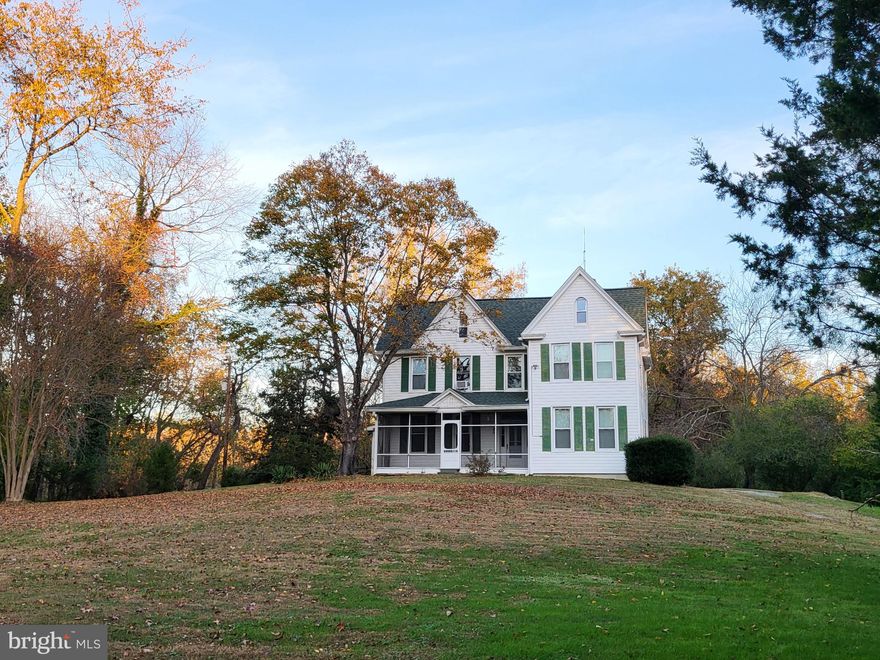 Return to the romance of a simpler time as you stroll through the 3 acres of pasture and privacy!!! This gorgeous homestead-style property couldn't be in a better location of Owings---a quick drive will get you to the hustle and bustle of the city of DC--- yet you can just as quickly return to your old-world oasis!  Perfect property to have chickens and other farm animals.  Has a run-in barn in good shape and ready for a couple of horses.  Also has two large outbuildings/workshops with windows and electric.  Seller has a recent staked survey, for future fencing of property if desired.  A beautiful view of a neighboring pond in the back acreage welcomes wildlife such as fox, geese, deer, wild turkey, rabbits, Cooper's Hawk and Bald Eagles.  Tree lovers will enjoy the wide selection of trees --including Mulberry trees, Black Cherry,  Oak and Elm trees.  Blackberry bushes are already here, and just waiting for you to plant some strawberry and raspberry bushes too!  The large, 2,800 sf  +/-  farmhouse dates back to about 1900,  and sits majestically up on the front acre. It has all the charm and history of the era with its original hardwood floors throughout and exposed beams in the family room with a pellet stove that can warm the entire home.  You'll love the hand carved wooden staircase with its gloriously round newell post as you enter the foyer.  History buffs will also appreciate the ornamental trim around the doorways and windows, as well as the original hardwood doors, hinges and brass doorknobs! Has a 'turn of the century-style' parlor/formal living room with a beautiful wood-burning fireplace and mantel.   A large sunroom on the east side of the home, and a large, screened-in porch in front are perfect for enjoying coffee with the sunrises and wine with sunsets. Lots of storage in this home too with a full size laundry room,  multiple utility closets and a walkable attic space.  Has three bedrooms and a full bath upstairs (with two connecting but with one that has access also by a servant's staircase). The first-floor full bath has a large linen closet and a dressing room area with closet organizer.  Main floor has a functional 4th bedroom or home office (with windows and could easily add a closet).  Has a large storage room adjacent that one could easily renovate into a primary suite.  But you'll find lots of updates and improvements have already been done, including an updated kitchen with oversized center island and granite countertops.  Has updated cabinetry and stainless-steel appliances, including a built-in microwave.  Plenty of room for table space, and has new french doors that lead from the kitchen to a deck overlooking pastural views.  Has a 30-year architectural shingle roof (2018) and two new Mitsubishi mini-splits (2020). The entire upstairs was rewired in 2019, including the upstairs bathroom rewired for a future remodel, if desired.  All light fixtures are also new throughout the home.  Located in area of top-rated schools.  Is easy commute to Joint Base Andrews and close to shopping and restaurants. Live your dream by making this your new homestead in Northern Calvert County!