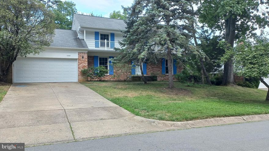 Very large sf home with wood floors, five bedrooms upstairs, finished walk-out lower level with play room, 6th bedroom/office, 3rd full bath and large unfinished area;  2-car garage with car charger outlet, ample off-street parking, huge deck,  laundry/utility/mud room, first floor family Room, banquet sized dining room, table space kitchen.