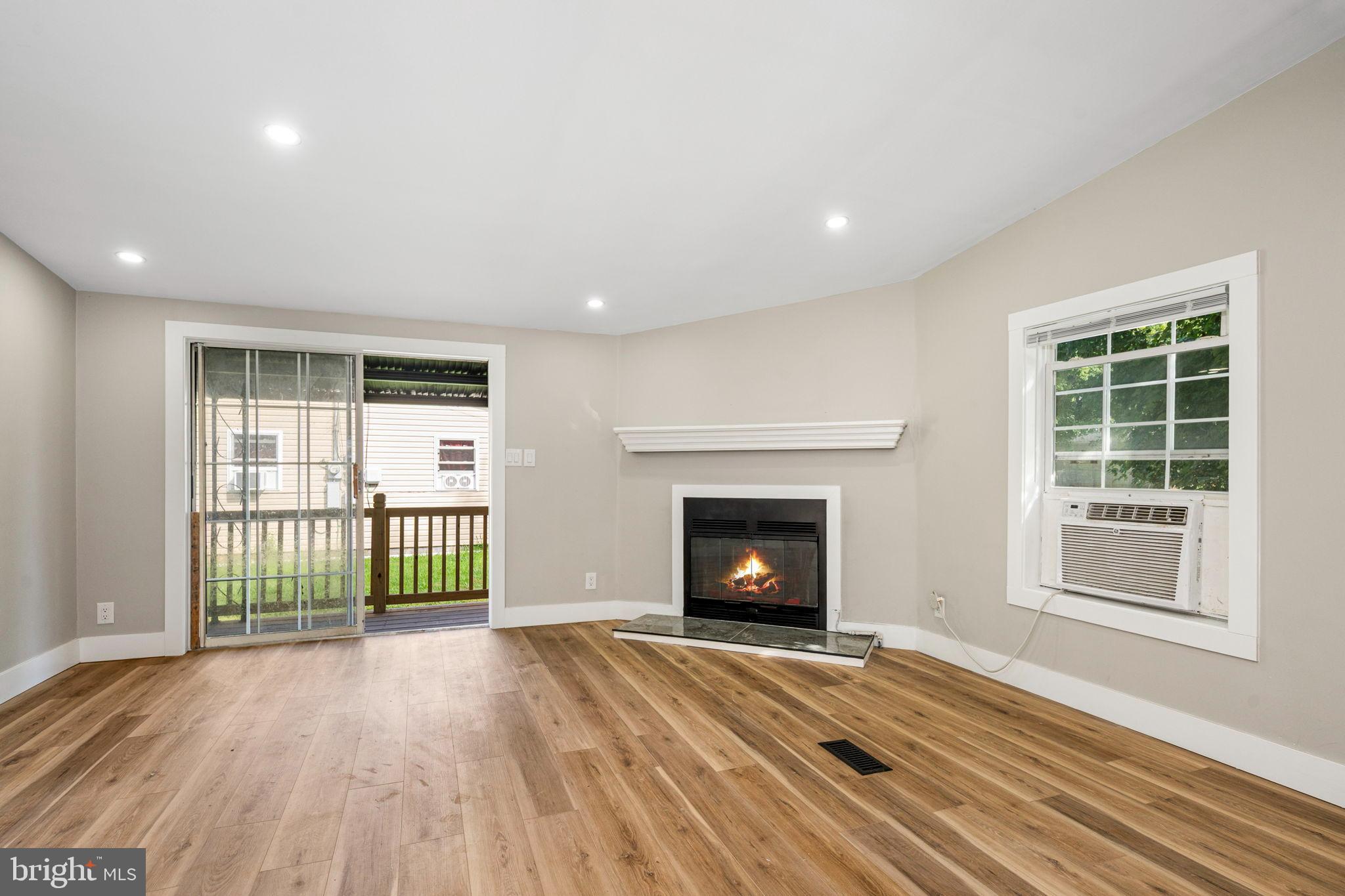 This freshly remodeled 3-bedroom, 2-bathroom residence offers a perfect blend of comfort and modern elegance. This well maintained home showcases an open floor plan, inviting natural light to dance through the spacious living areas. Step inside to discover luxury vinyl plank flooring that connects each room, creating a warm and cohesive atmosphere. The heart of the home features a well-appointed kitchen equipped with electric appliances, including an oven/range and a convenient microwave above. The open layout encourages effortless entertaining, allowing you to engage with guests while preparing meals. Retreat to the generously sized bedrooms. Enjoy the convenience of main-floor laundry. Outside, the property boasts a manageable 0.17-acre lot, providing ample space for outdoor activities or gardening. The driveway offers convenient parking. Experience the joy of living in a space that embodies comfort, elegance, and call it home.