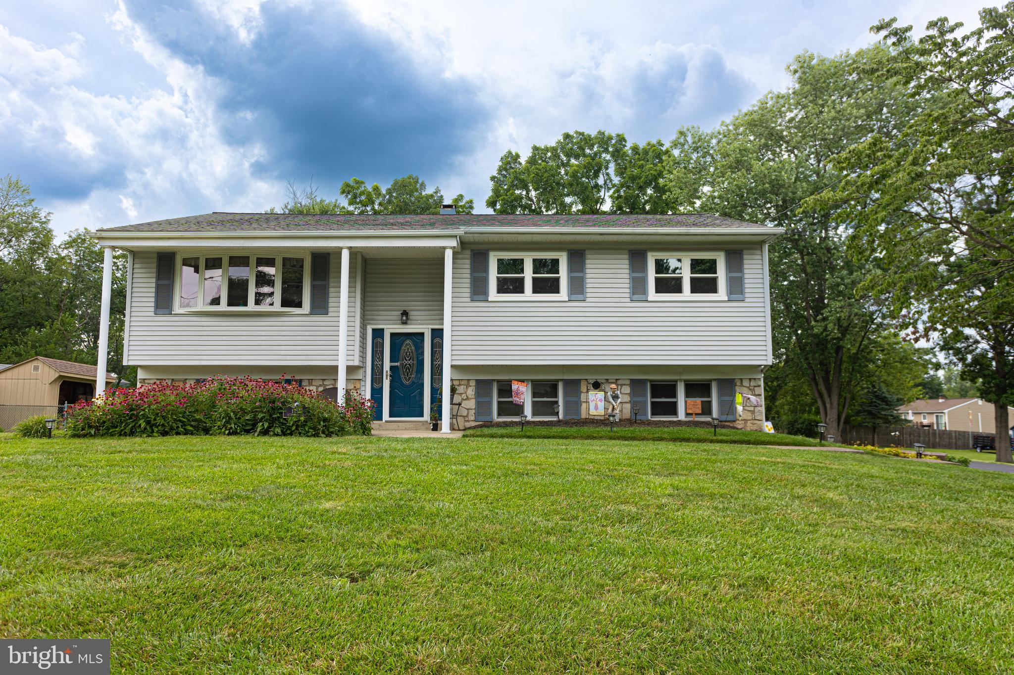 Welcome home to this meticulously maintained, move-in ready, home in highly desirable Phoenixville. This bi-level has 3 bedrooms and 2.5 bathrooms with 1 car garage and a long paved driveway. It sits on a peaceful and quiet street in lovely Evergreen Acres. From the moment you enter, you will notice the pride of ownership with the many upgrades throughout. Your guests will be in awe while being entertained in the beautifully upgraded kitchen. The kitchen was upgraded with granite counter tops, ceramic tile backsplash, large single bowl sink, pantry, and plenty of storage with soft close cabinets. Beautiful hardwood floors on the upper level in the living room and hallway. Each bedroom offers a ceiling fan and closet with sliding doors. Both upper level full bathrooms were recently updated with Bath Fitter tubs. Extend the entertainment from the kitchen sliders onto your composite deck with stairs to access the professionally landscaped yard and paver patio below. On the lower level is the family room with a walkout entrance to your patio and level large sized yard. Garage and flex space with a half bathroom complete the lower level. Convenient location to schools, parks, shopping, and all that downtown Phoenixville has to offer. Come take a tour before it's too late!
