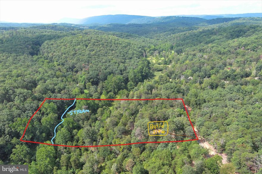 PRIVATE SLICE OF PARADISE.....NEARLY 4 WOODED ACRES THAT'S SURE TO PLEASE WITH ALL IT'S AMENITIES.....LOCATED AT THE DEAD END OF A STATE MAINTAINED ROAD FOR MAXIMUM PRIVACY, YET RELIABLE MAINTENANCE.....BRAND NEW DRIVEWAY WITH CLEARED BUILD/CAMP SITE OFFERING A PLEASING VIEW OF SOUTH BRANCH MOUNTAIN.....BOLD SEASONAL STREAM MEANDERS THROUGH THE PROPERTY.....IT'S RARE FOR A LOT THIS SIZE TO OFFER A VIEW AND A WATER FEATURE....IT'S ALSO SITUATED WELL FOR HUNTING AND SHOOTING DUE TO IT'S TOPOGRAPHY AND THE FACT THAT IT BACKS TO LARGER TRACTS.....EASY ACCESS, ONLY 1/4 MILE OFF THE PAVED ROAD, 10 MINUTES FROM ROMNEY, 2 MILES FROM PUBLIC ACCESS ON THE SOUTH BRANCH OF THE POTOMAC RIVER, 5 MILES FROM "WHITEHORSE MOUNTAIN WILDLIFE MANAGEMENT AREA" 1700 ACRES OF PUBLIC HUNTING & HIKING AND ONLY 30 MINUTES FROM CUMBERLAND, MD......HERE'S THE BEST PART.....NO HOA DUES AND VERY MINIMAL RESTRICTIONS: NO SINGLE WIDES, NO TINY HOMES, NO COMMERCIAL BUSINESS....OTHER THAN THAT, JUST ABOUT ANYTHING GOES! THIS LOT IS SNEAKY GOOD, PERFECT FOR A RECREATIONAL CAMP SITE OR IT'S PLENTY GOOD ENOUGH FOR BUILDING. IF YOU'RE NOT FIRST, YOU'RE GONNA BE LAST ON THIS ONE!