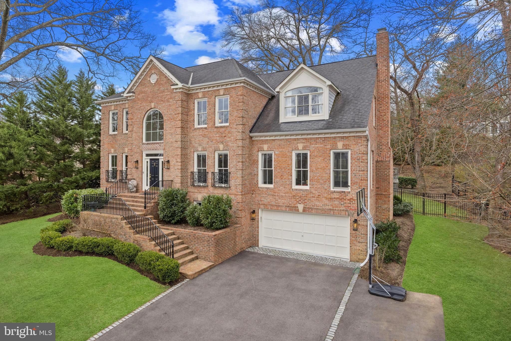 Exquisite Custom Home with Year-Round Potomac River Views.
Nestled on one of Alexandria’s most prestigious and exclusive streets, this stunning custom-built residence offers breathtaking, year-round views of the Potomac River. Designed with elegance and craftsmanship by its original owners in 2002, this home has been meticulously maintained and thoughtfully updated with over $200,000 in recent renovations and upgrades.
Perched above its neighbors, this home provides an unrivaled vantage point to watch the sun rise over the horizon each morning. Spanning over 4,500 finished square feet across three levels, it boasts a versatile and spacious layout ideal for both grand entertaining and comfortable everyday living.
Sophisticated Interior Spaces
As you step inside, you are welcomed by a breathtaking two-story foyer, where a grand curved wood staircase serves as a stunning focal point. The walls are elegantly adorned with intricate custom wall and picture molding, adding a touch of refined sophistication and timeless architectural charm.
The home features 4 bedrooms, 4.5 baths, and an oversized two-car garage. Its well-appointed floor plan includes a formal living room with river views, a formal dining room with patio access, and a graciously sized main-level family room, where three large windows frame stunning water views. A dedicated at-home office with custom built-ins and river vistas makes working from home a dream.
At the heart of the home is the 2022 custom chef’s kitchen designed by esteemed St Clair Kitchens, featuring top-of-the-line appliances, including a Thermador gas range, 48-inch refrigerator, two dishwashing drawers + dishwasher, beverage fridge, and two sinks. The oversized Calacatta Gold marble island (2-inch thick) serves as a striking focal point, while custom cabinetry offers soft-close drawers and doors, a roll-out spice cabinet, a dedicated small appliance cabinet, and a pantry cabinet. The kitchen flows seamlessly into a sunny breakfast nook and the expansive family room, complete with a wood-burning fireplace and stunning river views.
Luxurious Primary Suite & Elegant Upper Level
The upper-level primary suite is a private sanctuary, featuring vaulted ceilings, two walk-in closets, and a charming dormer window nook—a perfect spot for a loveseat by the fireplace to enjoy the panoramic views. The spa-like primary bath, remodeled in 2017, boasts dual vanities, a frameless glass marble shower, heated tile floors, a standalone soaking tub, and a private water closet.
Outdoor Oasis
The backyard is an entertainer’s dream, featuring a full-length flagstone patio, a firepit, and an outdoor fireplace, perfect for crisp spring and fall evenings. Thoughtfully landscaped and fully fenced, the tiered backyard offers a large, flat lawn—ideal for a playset, backyard games, and outdoor gatherings.
This exceptional home presents a rare opportunity to own a one-of-a-kind property in one of Alexandria’s most sought-after locations. With its unparalleled water views, exquisite updates, and impeccable design, this home is truly a masterpiece and living on Southdown is a gift!