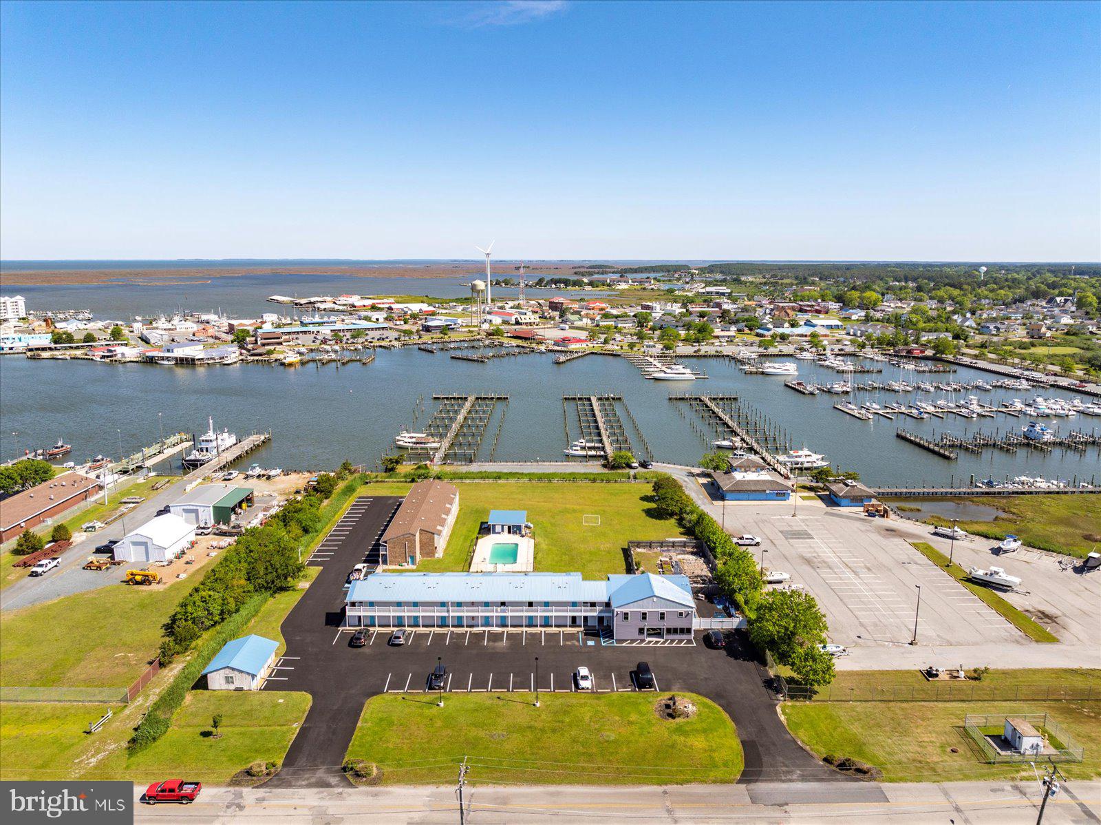 38 Room Hotel with many upgrades. This is the only hotel in Crisfield that sits on the water with beautiful Somers Cove Marina views. Rooms have water fronts views with pool was renovated 2 years ago. In 2020 the hotel extended its lobby and made a 4 bedroom apartment/home for the owners/managers over top the lobby. In the last few years all room have been Knock down and painted. 18 rooms have been updated with new floors and walk in showers. Building has had new siding put on front of building and new composite decking. In 2022 Somers Cove Hotel became a Choice Hotel as the Rodeway Inn. Since then the hotel and owners have received multiple awards, including Gold & Platinum top Hotel!!! That means they were in the top 3% of all Choice Hotels. Hotel is adjacent Somers Cove Marina. Only water-front guest lodging in Crisfield, MD. 2.47 ac site on $3000/yr 50 yr ground lease, w/ 25 yr renewal option. Features in-ground pool; 2 bldgs, harbor & marina views. Crisfield is a beautiful waterfront community, Maryland's Blue Crab Capitol, Chesapeake Bay sportsmen's' destination.