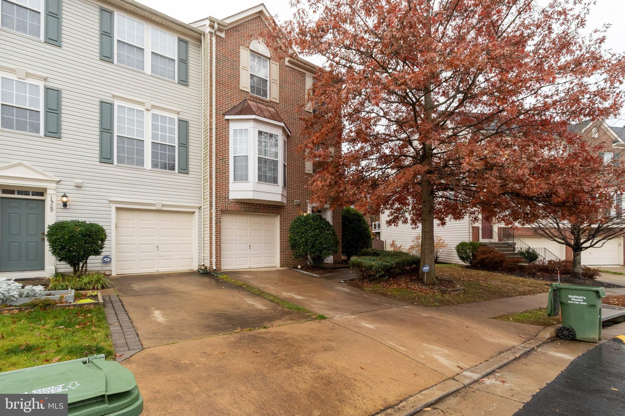 Truly stunning end-unit brick-front townhome ready for new tenants! This beautifully maintained home features an open floor plan with a spacious family room and an upgraded kitchen boasting hardwood floors, 42-inch cabinets, stainless steel appliances, granite countertops, and a center island. Enjoy outdoor living with a large deck off the breakfast area, steps leading to a fully fenced backyard, and a charming brick patio. The upper level offers a generous primary suite with a private bath, soaking tub, and separate shower, along with two additional bedrooms and a full hall bath. The finished lower level adds extra living space—perfect for a home office, gym, or recreation room. A perfect blend of comfort and style—don't miss this one!