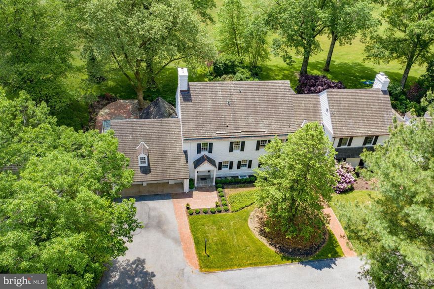 VIRTUAL TOUR AVAILABLE ON LINE. Visit  https://my.matterport.com/show/?m=H9S1LCdZGqM&play=0&wh=0&ts=2&guides=0&brand=1&vr=1 for a 3D walkthrough, and  https://www.seetheproperty.com/r/348786 for photos, floorplans & more! On a private road in a world-class neighborhood, surrounded by mature trees and manicured lawn, this exceptional home has panoramic views over 22 acres of meticulously tended grounds, within walking distance to the Weyhill Golf Course of the Saucon Valley Country Club.  Beautifully redone in 2020, with every amenity one would expect, there are walls of windows in every room to frame the pastoral and protected vistas.  Part of a lovely eight home enclave that is reminiscent of a New England village green, this exceptional home is tucked away at the end of the road, in a location that invites you to linger and enjoy the beauty of the environment. The exquisite remodel and gracious new design is a fabulous surprise.  It offers a wonderful flow for entertaining, with rooms opening onto two terraces, a covered porch, and lovely gardens.  An enormous great room boasts floor-to-ceiling windows, French doors, formal fireplace and breakfast alcove. The breathtaking new kitchen has the latest in high-end appliances, and opens to an adjacent dining/family room with wet bar while a first floor den is an additional get away.  Throughout, attention to detail is evident in the beautiful wood floors, crown moldings and new windows, while an elevator accesses three levels. The brand new master suite will delight with a generous master bedroom, 9 foot ceilings, custom walk-in closet and breathtaking views.  An elegant master bath is a soothing addition with soaking tub, exquisite vanities, walk-in shower for two and, again, exceptional views.  Two additional en suite bedrooms and new laundry room complete the second floor.  Rarely does a home offer such a classic and elegant ambience, in a cutting edge design, surrounded by an outside environment that invites you, daily, to walk the acreage and private roads.