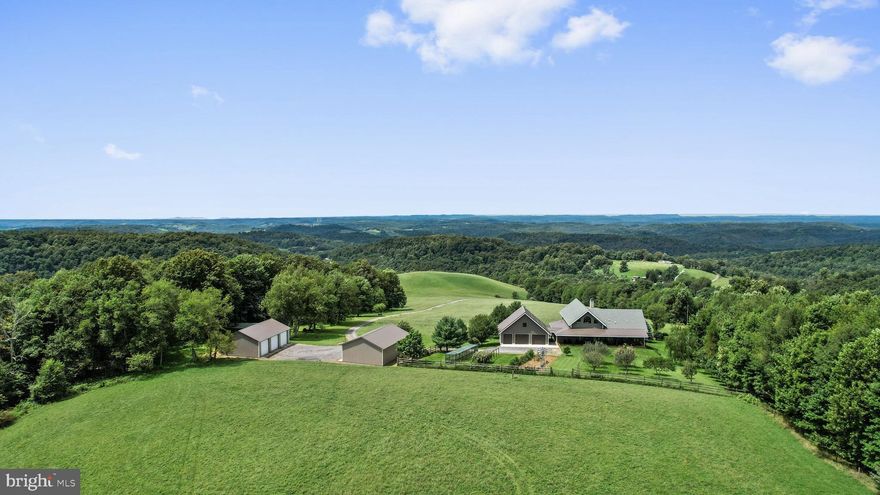 Incredible 7200+ Sq. Ft. timber frame house hidden in the mountains of Preston County, WV on 500 +/- Acres of woods and meadows with panoramic views in all directions. Minutes from the Cheat River. Excellent hunting for abundant wildlife including deer, turkey and bear. Orchard and garden. Several shooting houses and food plots.  600 yd. shooting range and pistol range.  Miles of trails for ATV's, horses, and hiking. Multiple garages, barns, and buildings and a 3 BR well maintained farmhouse also included.  Mineral Rights negotiable.