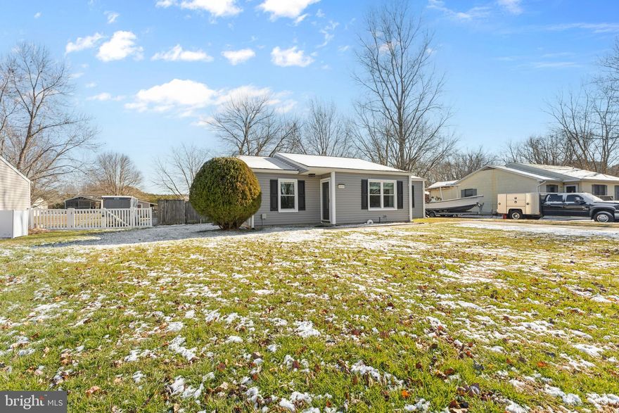 Welcome to this Harbor View home offering approximately 1,108 square feet of comfortable, updated, one-level living on a spacious 1/3 ac lot. The backyard is fully fenced and ready for pets, play, and entertaining, with a long driveway and double gates for easy access. Enjoy outdoor living with a deck and an inflatable hot tub in the backyard that is available to convey.

Inside, the layout is both functional and private, featuring three bedrooms and two full baths. The primary bedroom is generously sized and includes an en-suite bath, thoughtfully positioned on the opposite side of the home from the two additional bedrooms and the second full bath. Well-maintained laminate flooring runs through the main living areas, while the two additional bedrooms offer wall to wall carpet for extra comfort. The eat-in kitchen is bright and welcoming with updated appliances in 2023 and plenty of space for everyday meals.

Major improvements provide peace of mind, including a new roof with a transferable lifetime warranty, new siding, gutters, and downspouts, plus added attic insulation and new windows with screens throughout, all completed in 2024. Additional updates include a newer dryer, ceiling fans installed in 2022, a water conditioner, and an HVAC system replaced in 2020.

Conveniently located with quick access to Route 50 for an easy commute to Baltimore and Washington, DC, and just minutes to the Bay Bridge. The Harbor View community pavilion and playground, plus nearby everyday conveniences like dining, fitness options, and a local bakery, add even more value to this sought after neighborhood. Move-in ready and packed with upgrades.