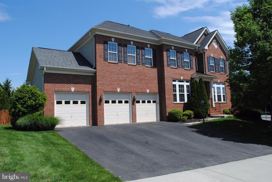 Entertain friends in this spacious, bright, & open 6bd/5bth home.Nearly 6000 spacious sq ft with grand entrance, stone fireplace, new appliances and carpet.Large master suite and convenient bedroom/office on main level. Enjoy the wet bar w/ theater in the basement.Relax in the hot tub & enjoy hassle free yard w/ custom lighting, sprinkler system, & stone patio.