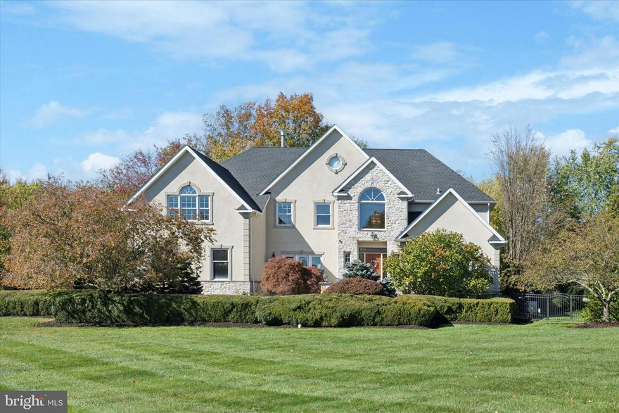 Make sure to view the virtual tour! 205 Amour Circle is located in the exquisite Normandy at Blue Bell Estate, where sophistication meets everyday luxury. Welcome to this spectacular 5-bedroom, 4 full and 3 half-bath residence in the highly sought-after Normandy at Blue Bell community. Perfectly situated on one acre of beautifully manicured, tree-shaded grounds, this home blends timeless elegance with modern amenities. Step inside the two-story foyer, where a sweeping staircase and abundant natural light set the tone for the rest of the home. The formal dining room sits gracefully to the left, while a formal living room offers an inviting space for entertaining to the right. The gourmet kitchen is a chef’s dream, featuring a center island, granite countertops, tumbled marble backsplash, upgraded cabinetry, and  walk-in pantry. Brand new refrigerator and cooktop stove, plus InstaHot water and filtration system, ensure every convenience. You will find a convenient half bath located just off the kitchen as well. Adjacent is the step-down family room offering warmth and style with Palladian windows and a gas fireplace with marble surround, while a rear staircase provides additional access to the upper level. The kitchen flows seamlessly into a sun-filled Florida room, boasting radiant heated ceramic tile floors, a granite bar with beverage fridge, sink, dishwasher, and direct access via sliders to the outdoor oasis.  Finishing off the main floor you’ll find a laundry room with new washer & dryer, second half bath, and 3-car garage along with a convenient walkout to the covered gazebo. Upstairs, the primary suite is a serene retreat complete with tray ceiling, a sitting area and yoga floor, designated vanity, three walk-in closets, and a luxurious ensuite bath recently remodeled with heated floors, copper tub and spa-inspired finishes. A Princess suite with private bath, plus two additional bedrooms and two full baths complete the second level. The fully finished third floor offers a versatile space ideal for a guest suite, playroom, or home office, featuring its own walk-in closet and full bath. The daylight finished basement with half bath extends the living space with four separate areas; including a gym, poker room, family room, and game area — all centered around a custom wet bar with built-in refrigerator and sink. Ample storage adds to the home’s functionality. Step outside to your private resort-style backyard featuring a flagstone patio, covered gazebo with stone fireplace, built-in outdoor TV, gas line for BBQ, surround sound, and a luxurious in-ground pool (new heater) with beautiful travertine pool patio and walkway with waterslide and fire pit all controlled via remote application. A professional basketball court, brand-new 2024 roof and a whole house Generac generator complete this remarkable property. Ideally located within the top-ranked Wissahickon School District, this home offers easy access to Whitpain Township parks, trails, golf courses, shopping, restaurants, Montgomery County Community College, and major commuting routes, including Route 309, the PA Turnpike, I-76, and I-476.This extraordinary residence truly checks every box — combining elegance, craftsmanship, and functionality in one perfect package. Don’t miss the opportunity to make this Normandy at Blue Bell luxury estate your forever home.