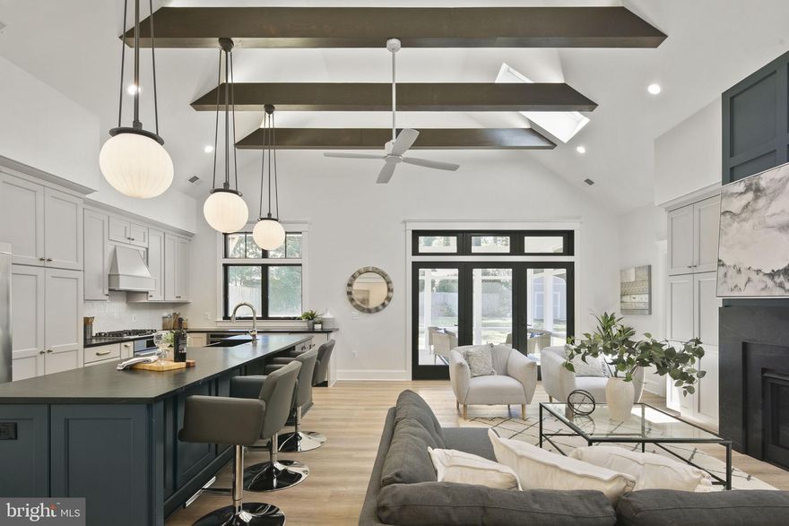 Nestled on a serene street in highly coveted Falls Church, VA, this newly renovated home epitomizes modern luxury and spacious living. Extensively expanded to nearly double its original size, the residence now showcases an impressive 2700 sqft of meticulously crafted living space.
Step inside to discover voluminous ceilings gracing the kitchen, family room, and a delightful screen porch adorned with skylights and rustic beams. Perfectly blending form and function, this home boasts 4 bedrooms and 3.5 baths, including a main-level oasis featuring 2 bedrooms and 2.5 baths for unparalleled convenience and accessibility.
Every detail exudes quality and sophistication, from top-of-the-line finishes to the impeccable design by acclaimed deJong Studio Architects. No expense was spared in the selection of materials, ensuring timeless elegance and enduring appeal. Master bathroom tile is handmade by Heath Ceramics. Soapstone counter tops and fireplace surround in the kitchen/family room.  Kemper cabinetry throughout the house and Rejuvenation light fixtures. Commercial grade Luxury Vinyl Planck flooring throughout for comfort and durability.  The mudroom with custom built ins and cubbies also boasts Clé tile.
Located in top McLean HS pyramid, this home is close to W&OD trail, West End Development, Mosaic District and West Falls Church Metro.