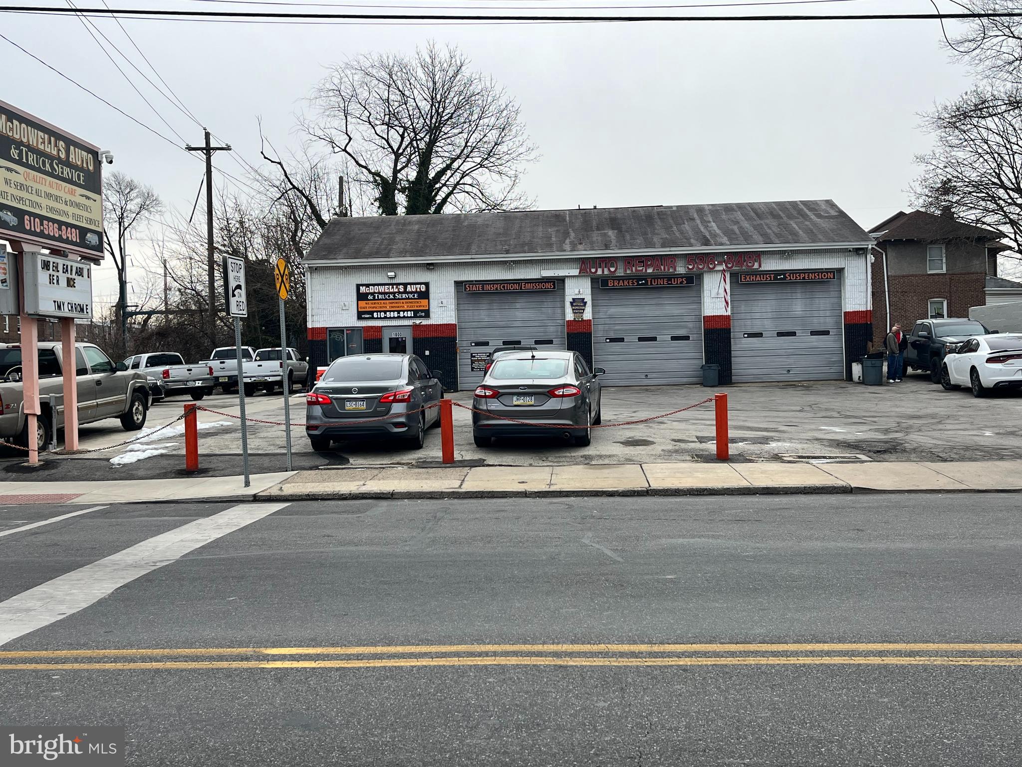 Discover an exceptional opportunity with this well-positioned 5 Bay Auto service Shop The property is strategically positioned in a prime location in the heart of a highly traveled business district and across from a Septa trolley and Bus stops. The two rear bays with a private driveway are set up with higher doors for bigger sized vehicles. The building has 2 offices and 2 bathrooms along with a nice-sized parking lot which makes it prime to operate possibly 2 separate shops. This MacDade Blvd. building boasts impressive visibility, and the business is presently operational. Please request appointments and be respectful of the business. Don’t miss this investment opportunity.
