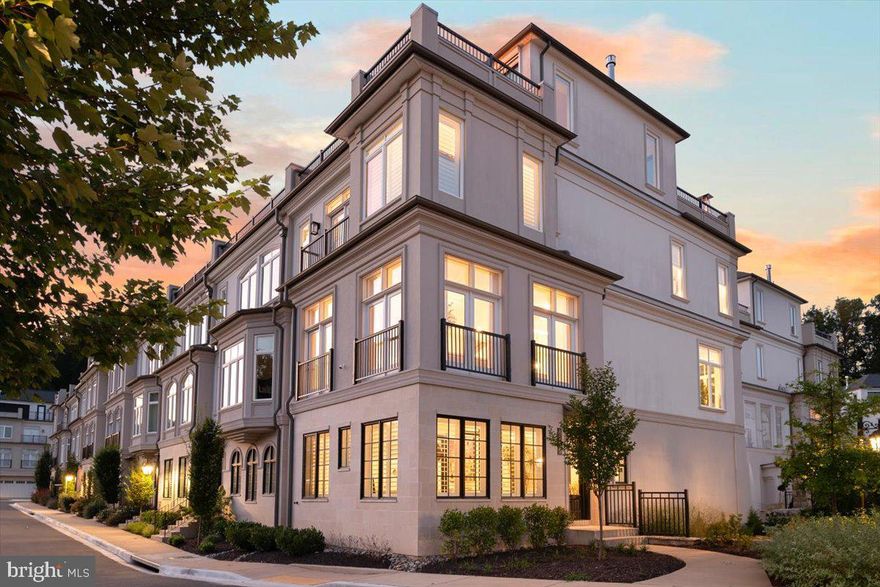 Welcome home to this exquisite end-unit rowhome in coveted Quarry Springs!  Thoughtfully and graciously upgraded, this sun-soaked beauty showcases top-of-the-line improvements that include Restoration Hardware light fixtures, custom window panels and drapes, additional built-ins, plantation shutters, sliding glass panels that open the upper level family room to two roof terraces.  Enjoy electric screens and electric shades that allow you to fully open or screen in the top floor, complemented by an outdoor kitchen and grill area.
The entry foyer greets guests with a custom-painted ceiling, lacquered doors, and dual RH chandeliers.  The office includes a discreet "inner office" designed to house printers and office equipment while maintaining the beauty of the main corner office.  An elevator provides convenient access to all four floors.  
On the next level, you'll find the centerpiece of the home:  the kitchen.  Boasting a 12-ft island and gourmet appliances, it's flanked on each end with the generously sized dining and living rooms, bar/coffee counters, and dual walk-in pantries.  Two gas fireplaces add warmth and charm to the space.  The third level owner's suite features an elegant entry foyer, an expansive walk-in closet with custom built-ins, and a spa-like bath.  Additionally, there are two more bedrooms and a full bath, as well as a spacious laundry room complete with cabinetry.
The top-level family room features includes beverage/bar area, a coffered ceiling, and walls of retractable glass that open onto dual terraces.  From the front terrace, enjoy serene, treetop views, while many rooms offer spectacular views of the fountain - particularly striking at night!  
 Quarry Springs offers a host of amenities, including a sparkling outdoor pool, fitness center, party and entertaining rooms, walking paths, a waterfall, gardens, and even a dog park!  This corner lot offers a premium view of the entrance fountain and gardens, as well as unobstructed treetop views from the front roof terrace, enhancing your enjoyment of the foliage.  
With 24-hour security and a gated entrance, peace of mind is paramount.   This location offers convenient access to 495/270 for easy commuting to DC and Tysons, along with proximity to two airports and the shopping and dining options of Potomac Village and Bethesda.  Don’t miss the opportunity to make this stunning property your new home!