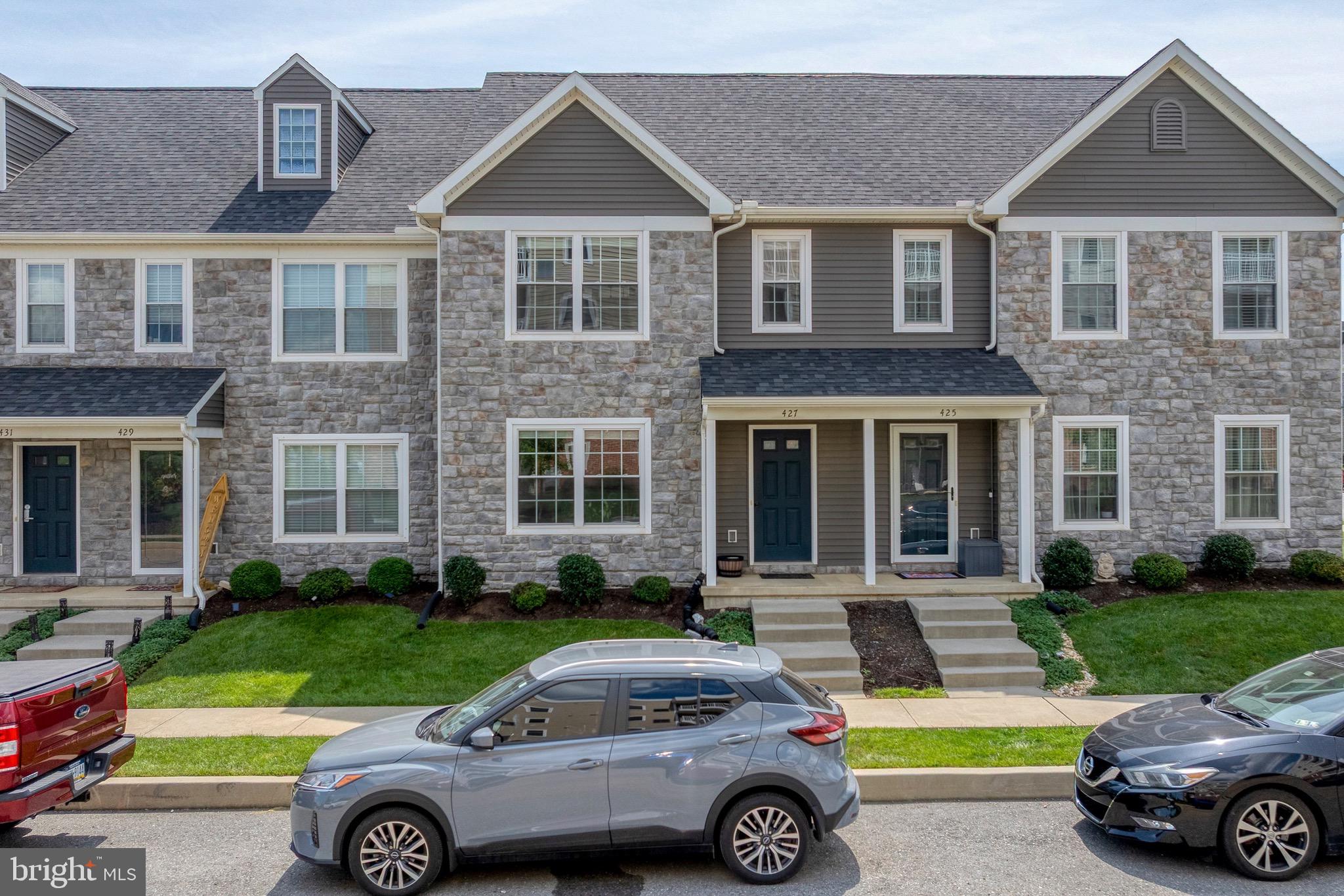 This beautiful townhouse on Springwood Drive, built in 2020, is nestled in the sought-after Trail Side community of Lebanon. Spanning three thoughtfully designed levels, this home offers inviting living spaces, modern conveniences and amenities, and a warm and vibrant community.
Step through the front door into a warm and spacious living room, where natural light fills the space, highlighting the gorgeous luxury vinyl plank flooring and creating an inviting atmosphere ideal for both relaxing and entertaining. The layout flows seamlessly into the dining area, perfect for both casual meals and dinner gatherings. The kitchen offers ample cabinetry and counter space. Whether preparing weeknight dinners or weekend breakfasts, this kitchen keeps everything within easy reach. Tucked conveniently on the first floor is a combined laundry and powder room, offering utility without compromising style. Just beyond the kitchen, is the one-car garage. Or step out to a small private patio, ideal for sipping your morning coffee or unwinding at the end of the day.
Upstairs, the primary bedroom suite is a peaceful retreat with lots of space, plush carpet, and soft, natural light. It features a private ensuite bathroom, creating a comfortable and secluded space to start and end each day. A second bedroom on this level provides flexibility—ideal as a guest room or home office—while the second full bathroom is just steps away, providing space and privacy for everyone. The entire third floor is dedicated to a capacious and versatile third bedroom. With a charming window alcove and abundant floor space, this room exudes character and warmth. It’s perfect as a bedroom, office, studio, or play room—whatever best suits your needs.
Located in the vibrant Trail Side community, this home comes with access to outstanding amenities including an outdoor pool, fitness center, welcoming clubhouse, and maintenance-free living with lawn care, snow removal, and trash service all handled for you. This is a stunning Lebanon home you won’t want to miss.