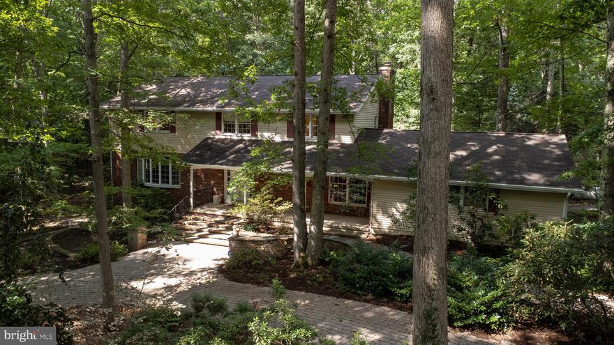 Relocate to peace & serenity in the hide-away setting of this unique 2-story perfectly positioned on 2.2 secluded wooded acres bordered by Patton Woods Natural Recreation Area. Although this home allows you to have your privacy it is also only an 8-minute drive to The Pennsylvania State University. As you walk through each room of the house peering out every window you will find breathtaking views of nature. Nearly 5400 sq ft of finished area, offering an enormous owners suite and adjacent owners bath, totaling 3 bedrooms and 3.5 baths. Enjoy the cozy fire with not one but two fireplaces! If that isn't enough, find yourself enjoying the roughly 2,400 sq foot room with radiant tiled flooring and walls of windows with endless possibilities! In addition to the attached two car garage there is also a large 3 car detached garage with a vast finished area above including electric and heat on the second floor. Priced to sell! Home being sold "AS-IS."